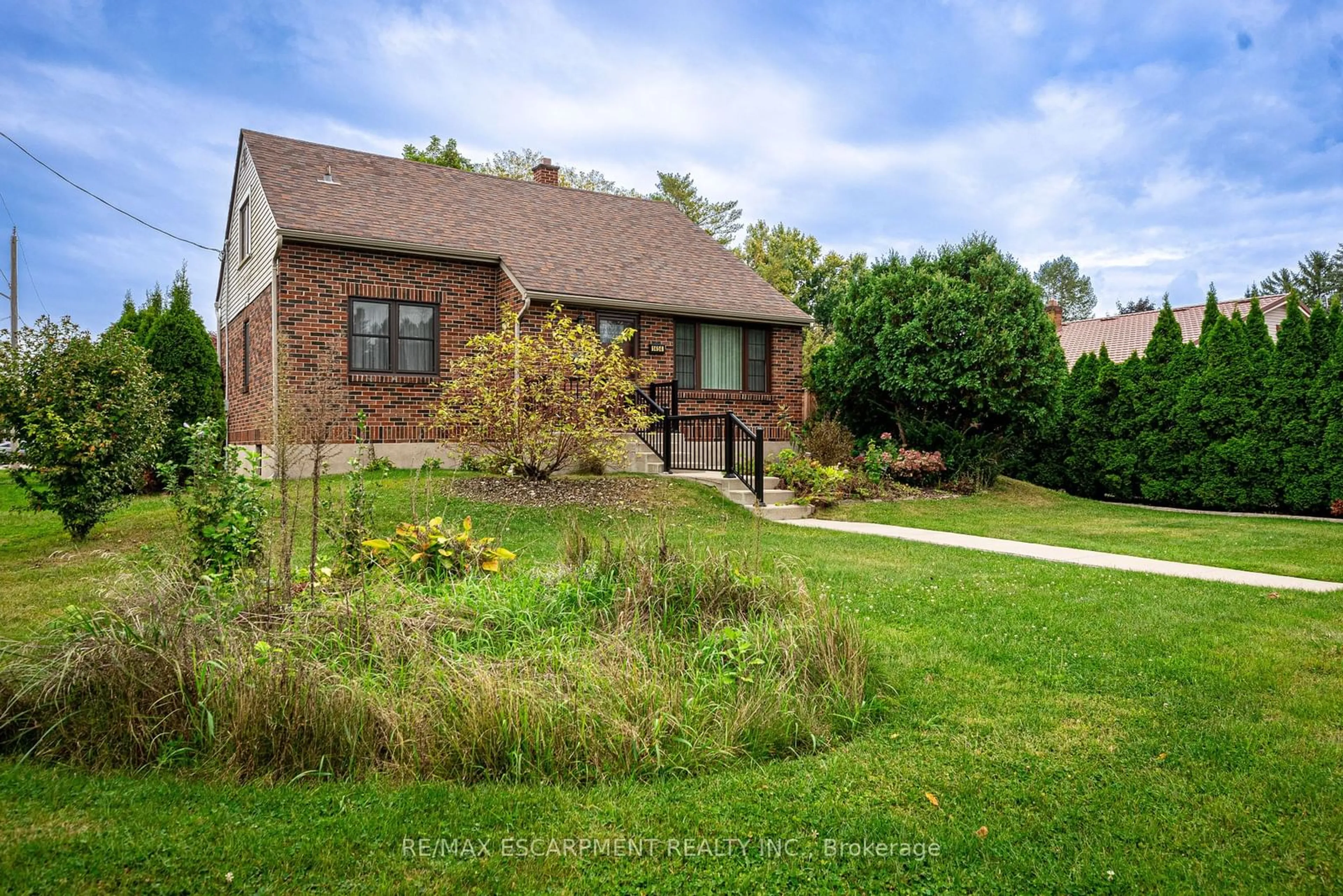 Frontside or backside of a home, the fenced backyard for 1454 Oakdale St, London Ontario N5X 1J6