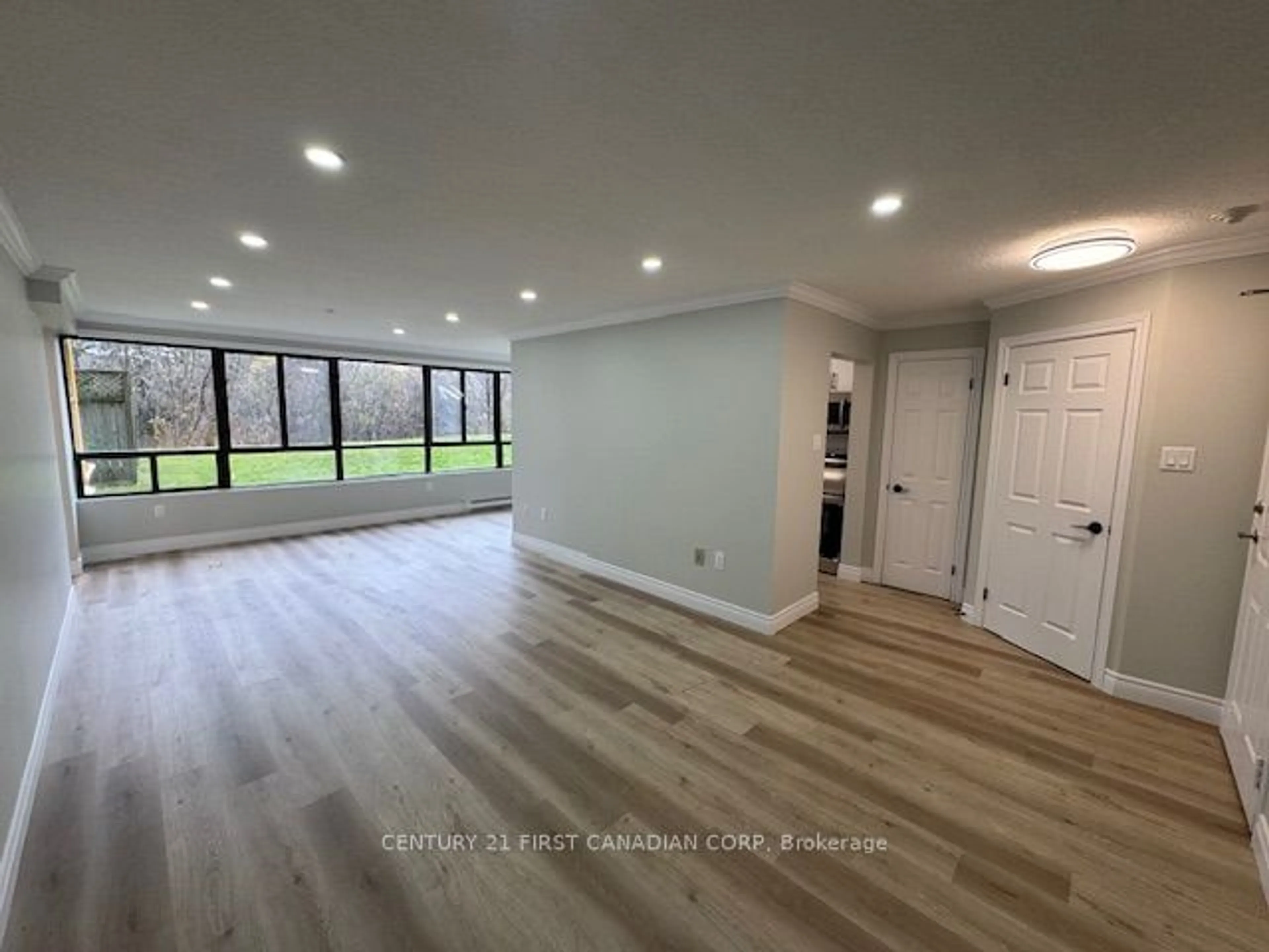 A pic of a room, wood floors for 1600 Adelaide St #107, London Ontario N5X 3H6