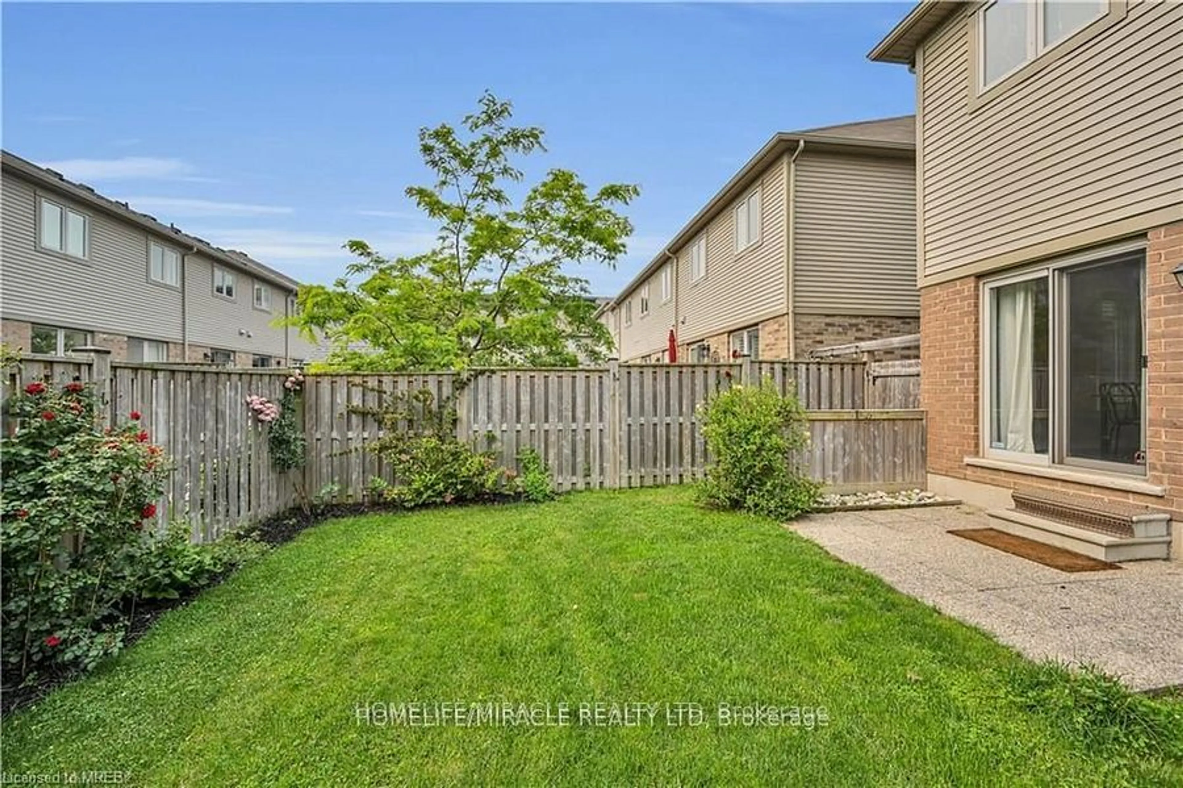 A pic from exterior of the house or condo, the fenced backyard for 515 Winston Rd Rd #59, Grimsby Ontario L3M 0C8