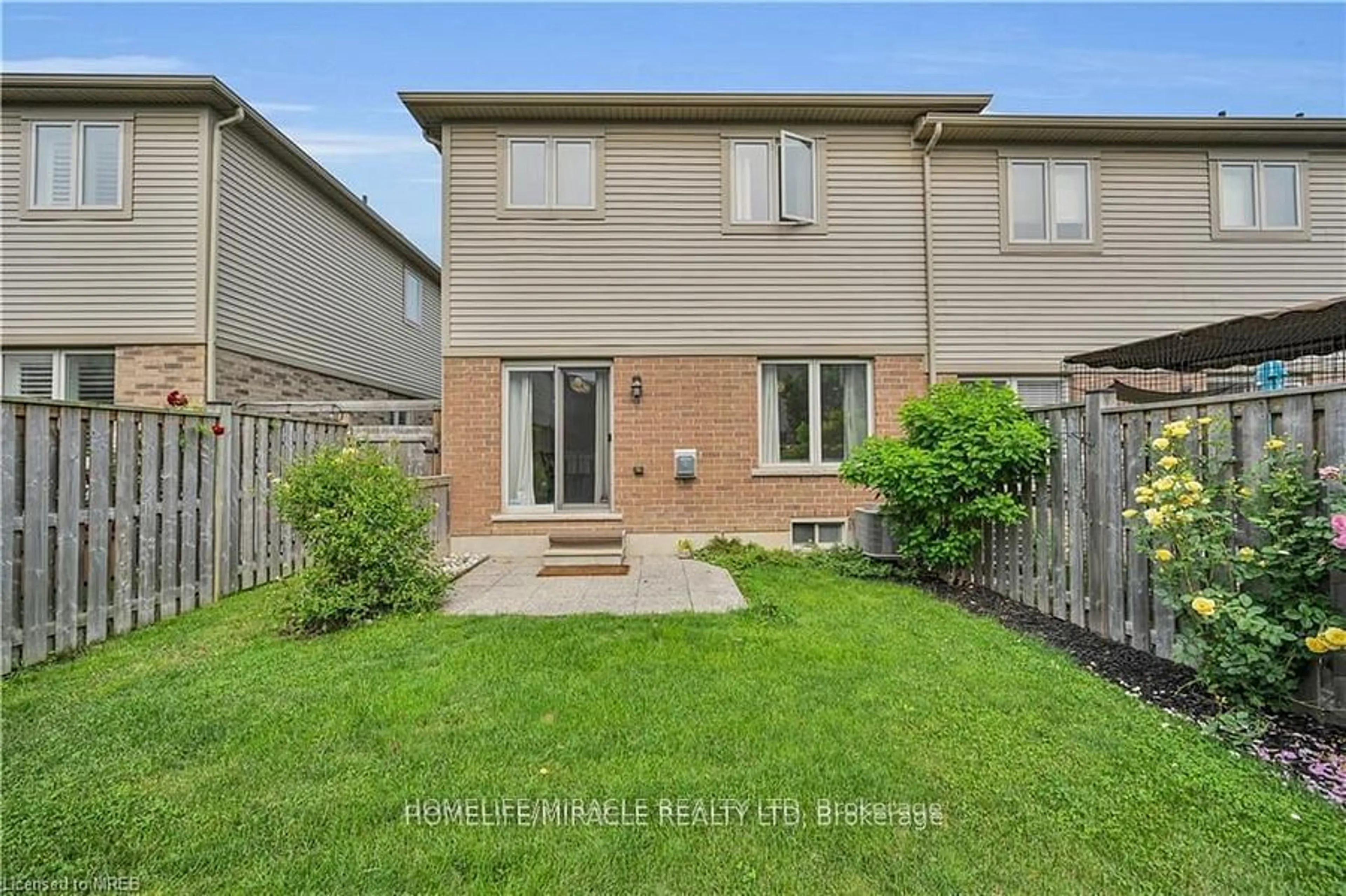 A pic from exterior of the house or condo, the fenced backyard for 515 Winston Rd Rd #59, Grimsby Ontario L3M 0C8