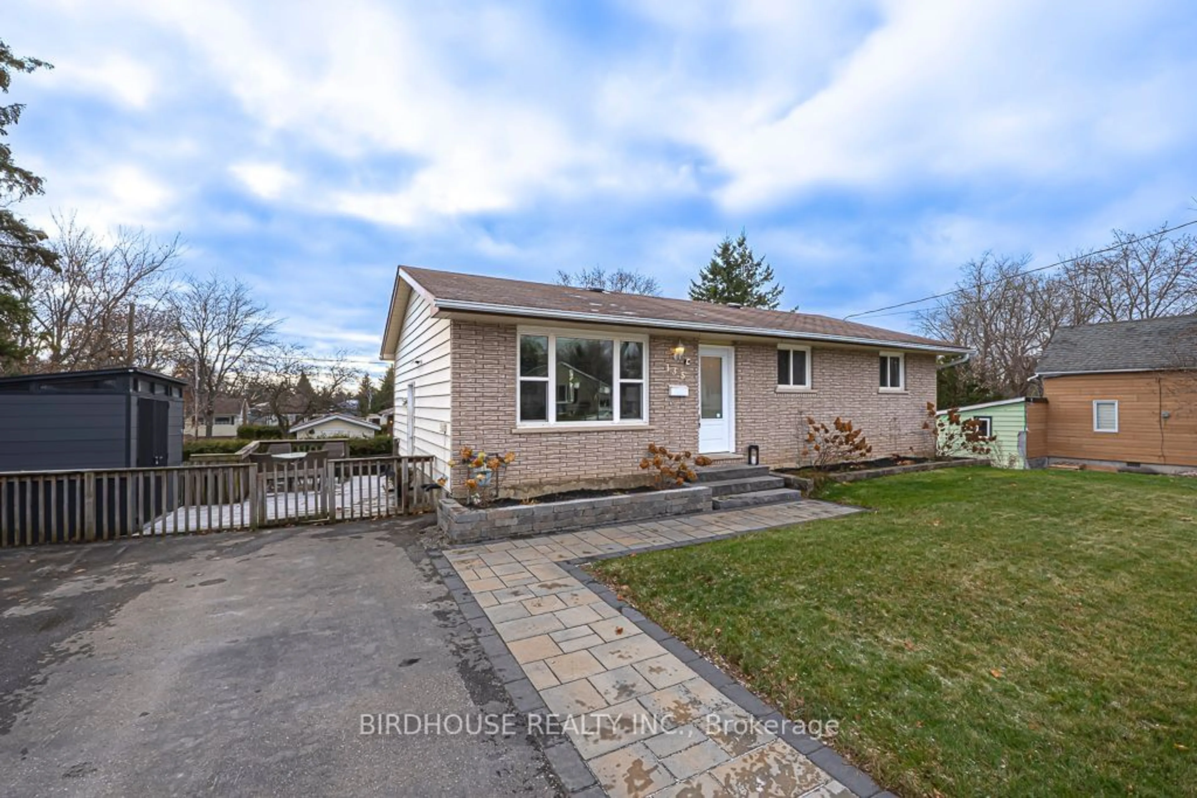 Frontside or backside of a home, the fenced backyard for 135 Queen St, Kawartha Lakes Ontario K9V 1G8