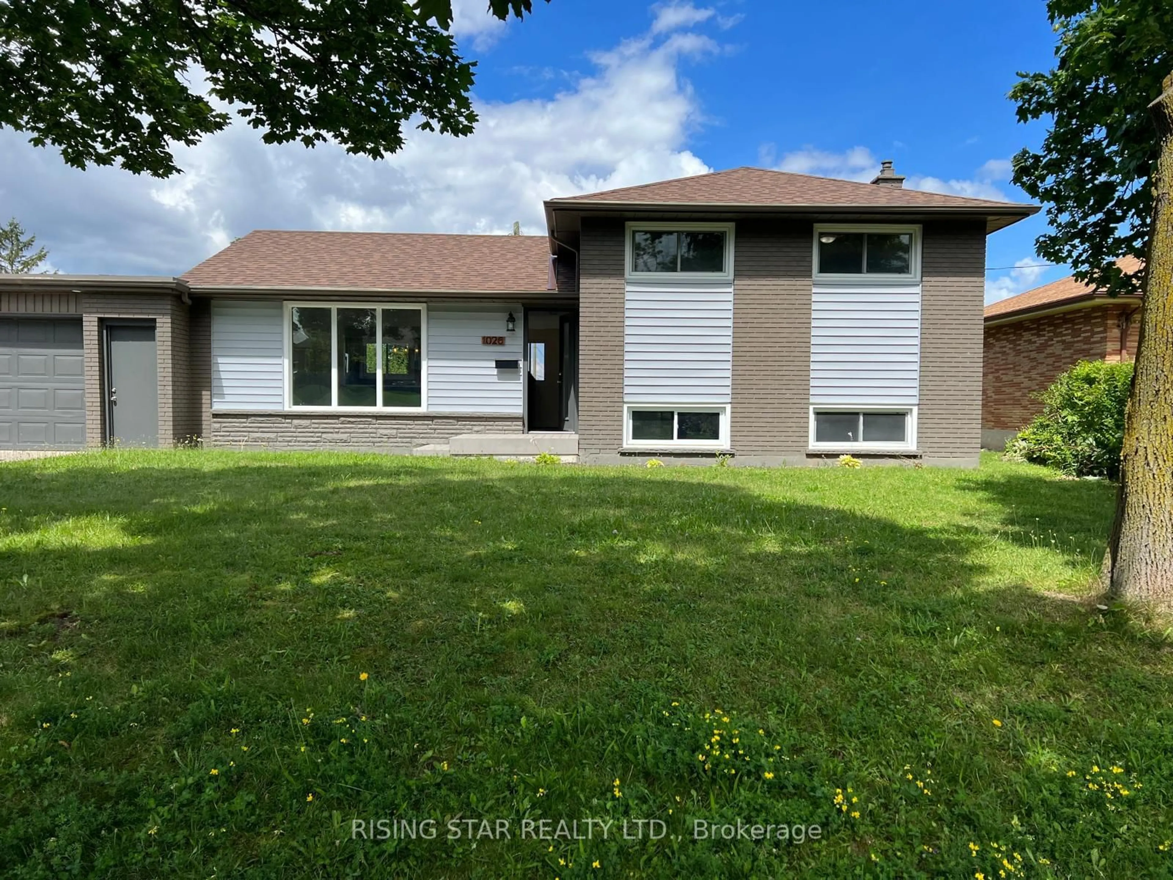 Frontside or backside of a home, the fenced backyard for 1026 Eagle Dr, London Ontario N5Z 3H5