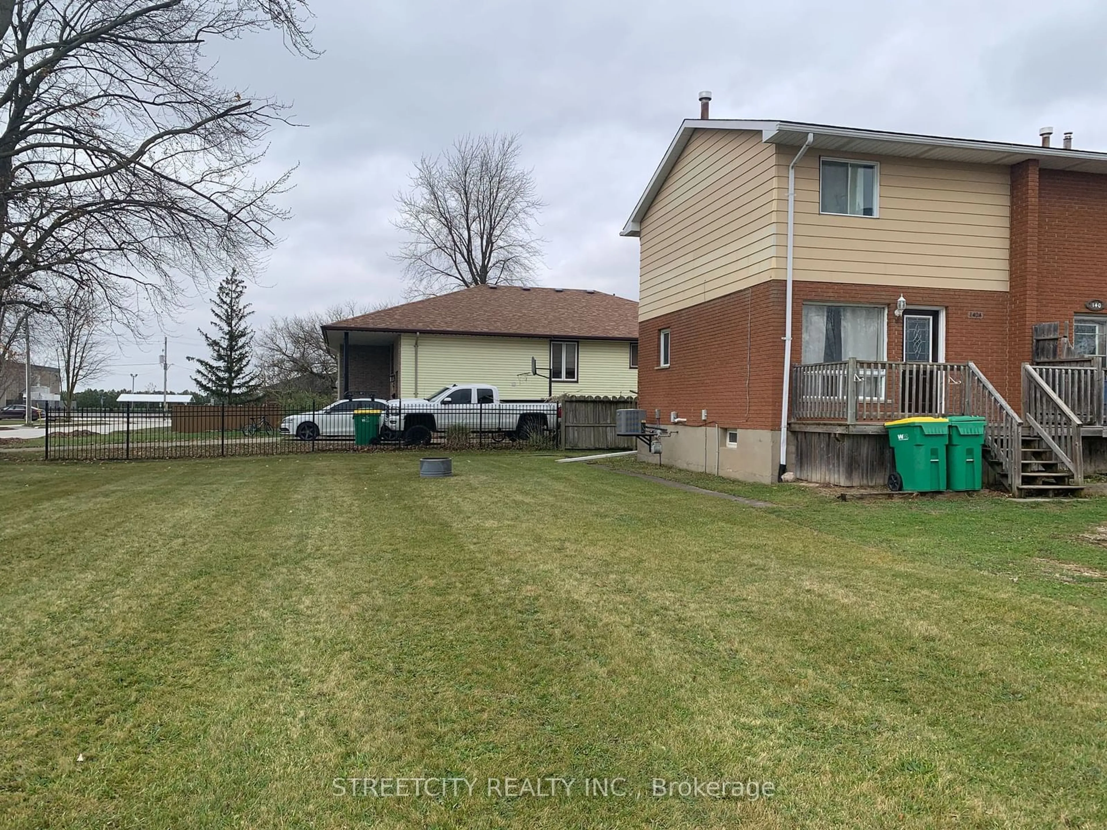 Frontside or backside of a home, the fenced backyard for 140 SYMES St #A, Southwest Middlesex Ontario N0L 1M0