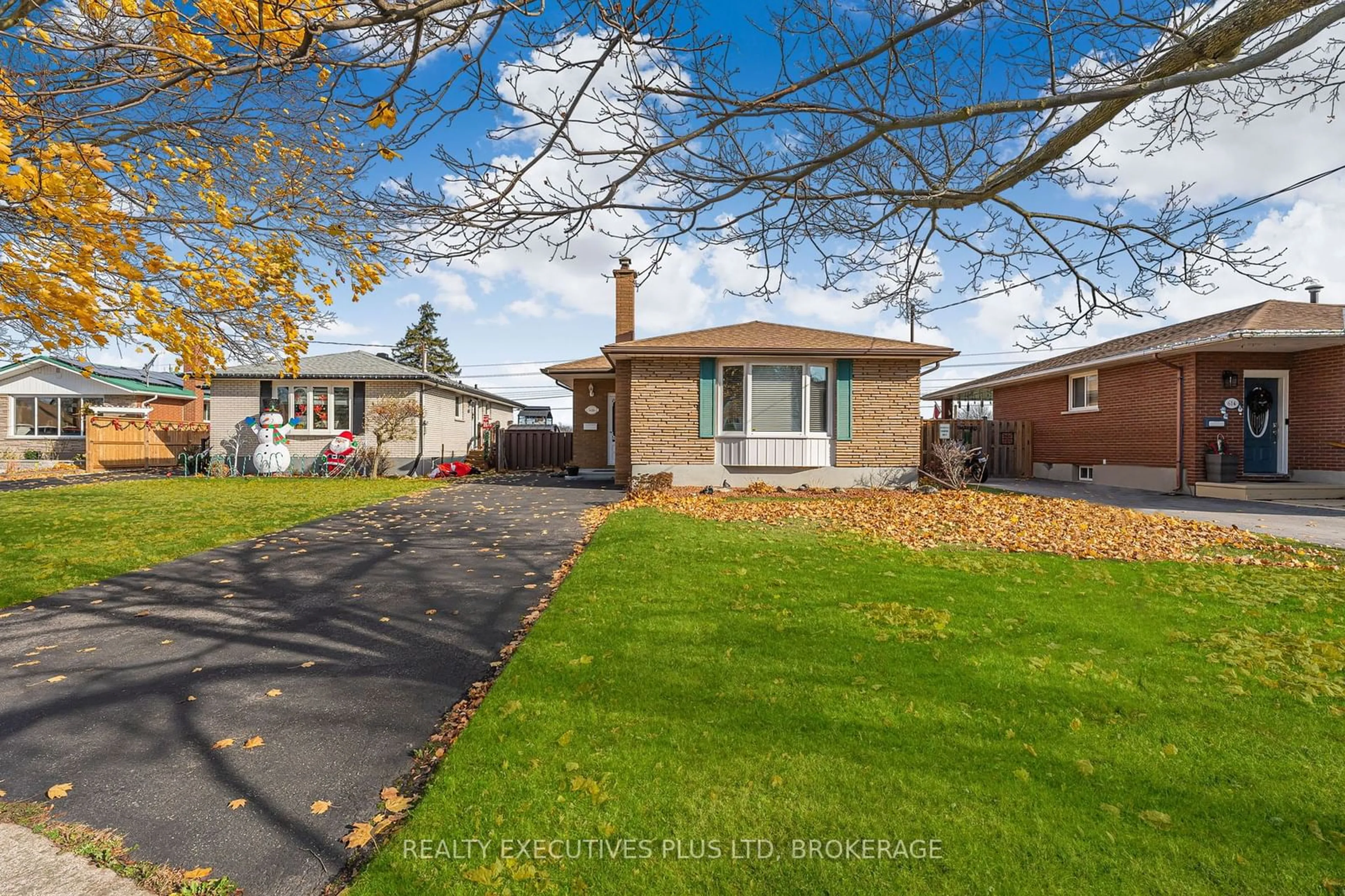 Frontside or backside of a home, the fenced backyard for 616 Bunting Rd, St. Catharines Ontario L2M 2Z8