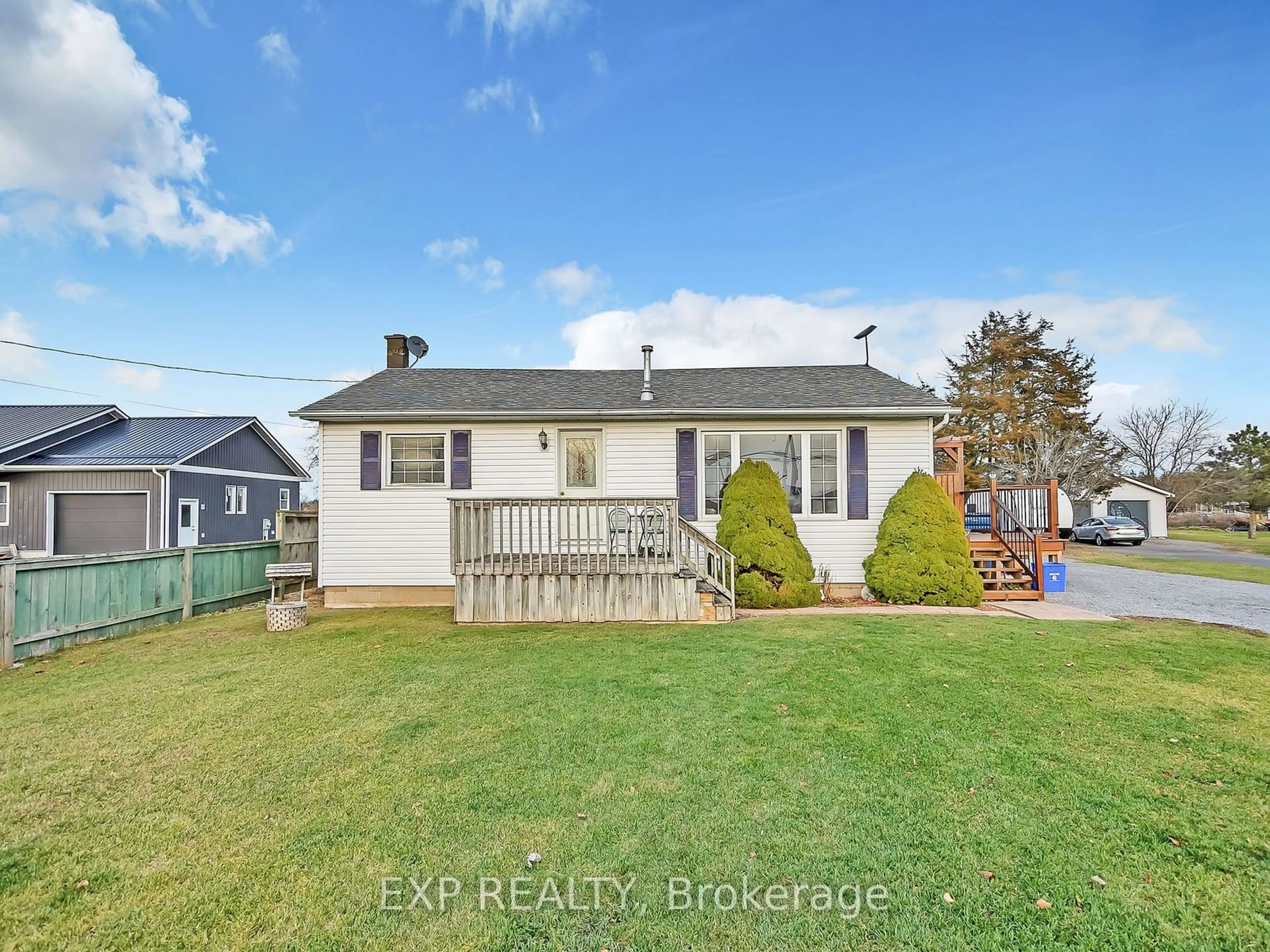 Frontside or backside of a home, the fenced backyard for 2686 County Road 5, Prince Edward County Ontario K0K 1W0