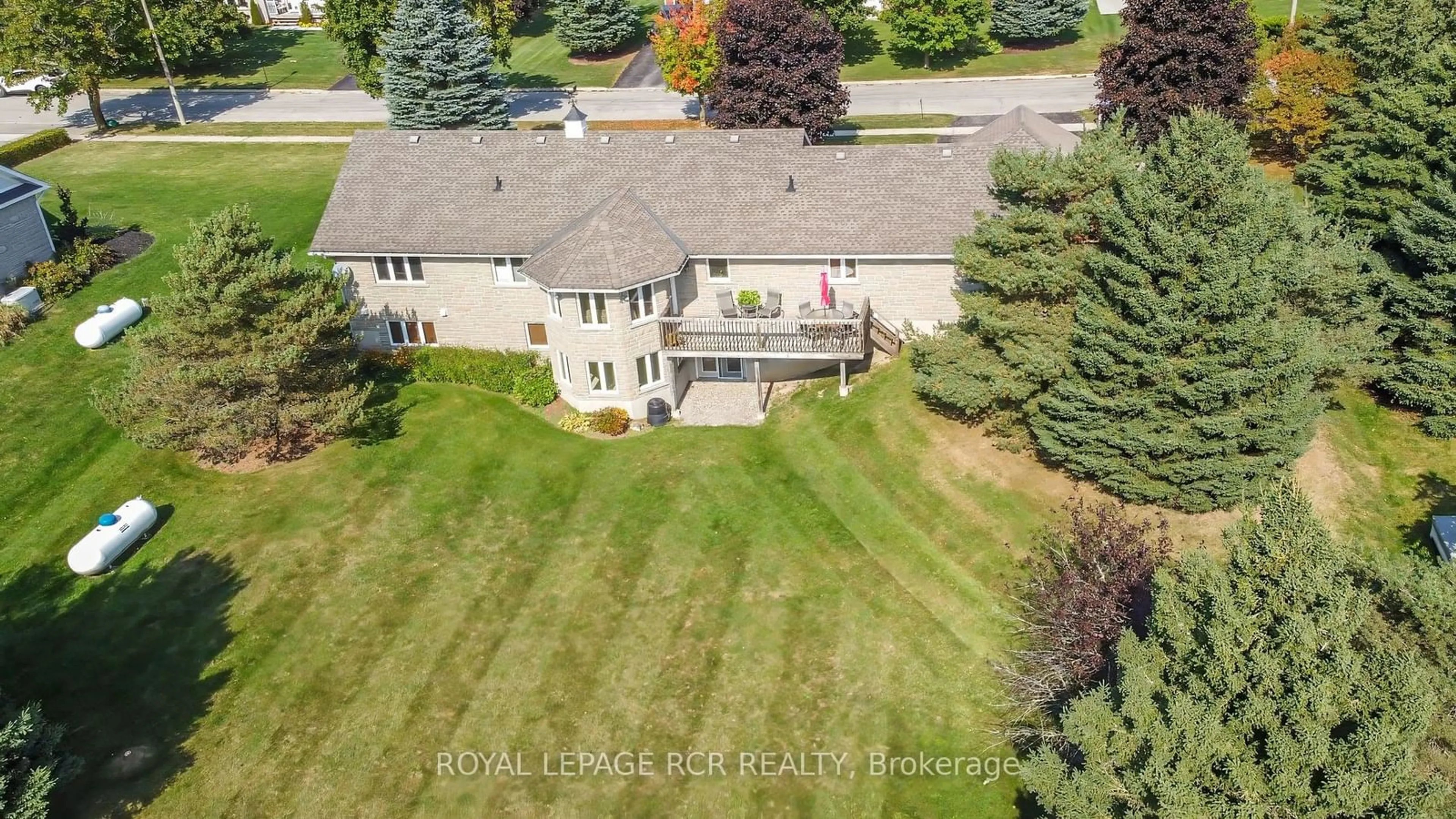 Frontside or backside of a home, the fenced backyard for 101 Conservation Tr, Centre Wellington Ontario N0B 1J0