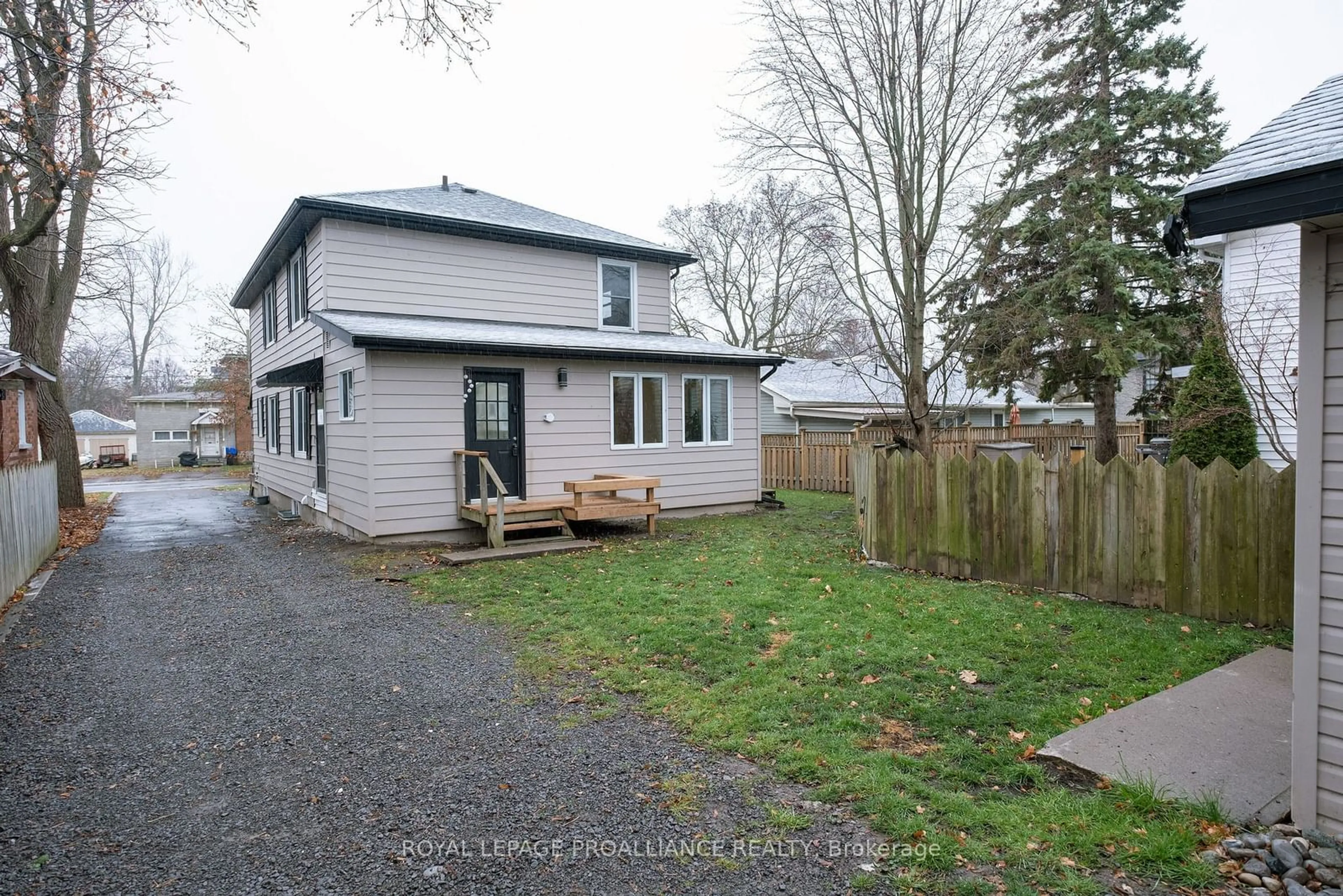 Frontside or backside of a home, the fenced backyard for 70 Queen St, Belleville Ontario K8N 1T9