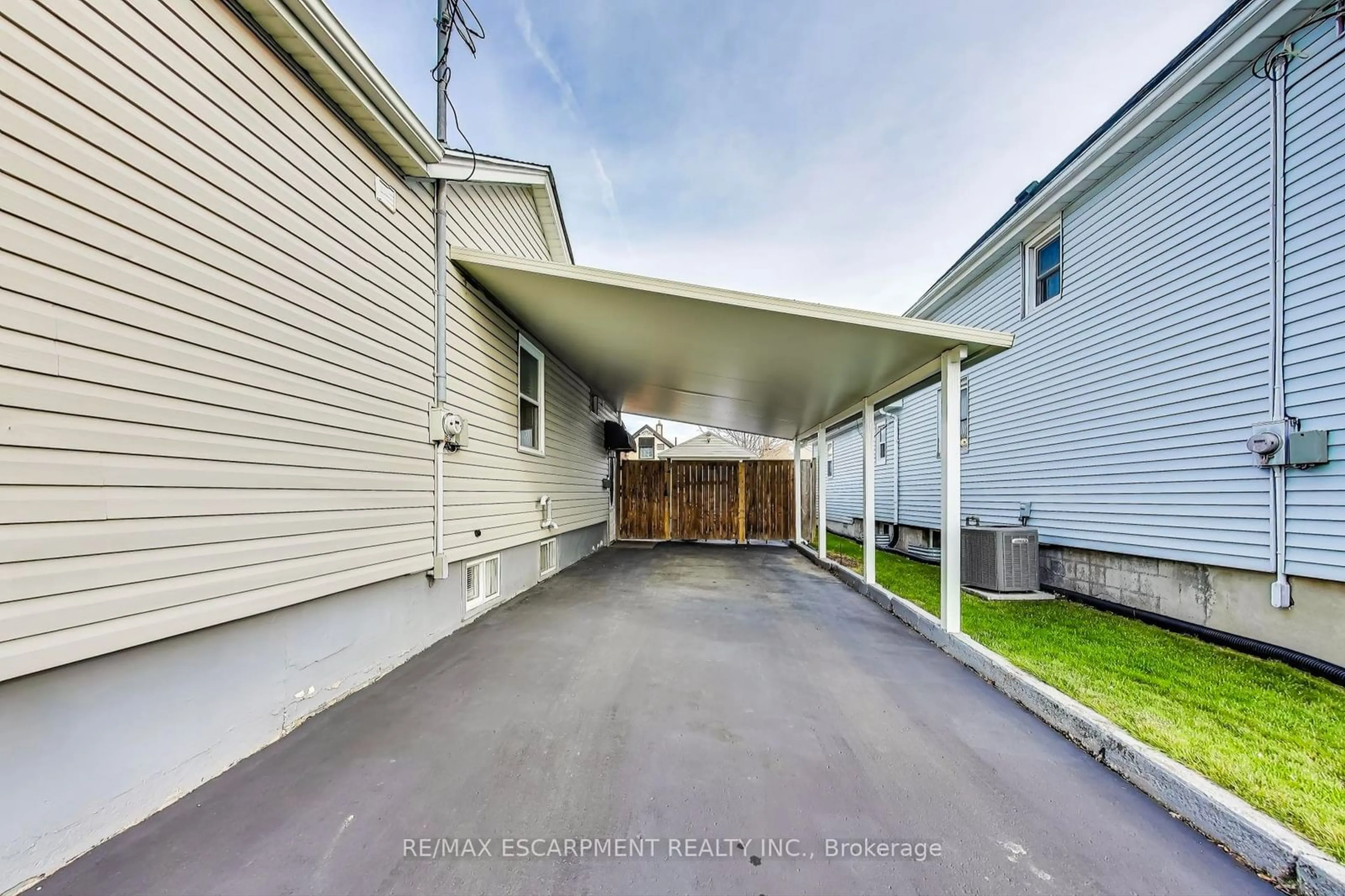 Frontside or backside of a home, the fenced backyard for 4 Martin St, Thorold Ontario L2V 3W8