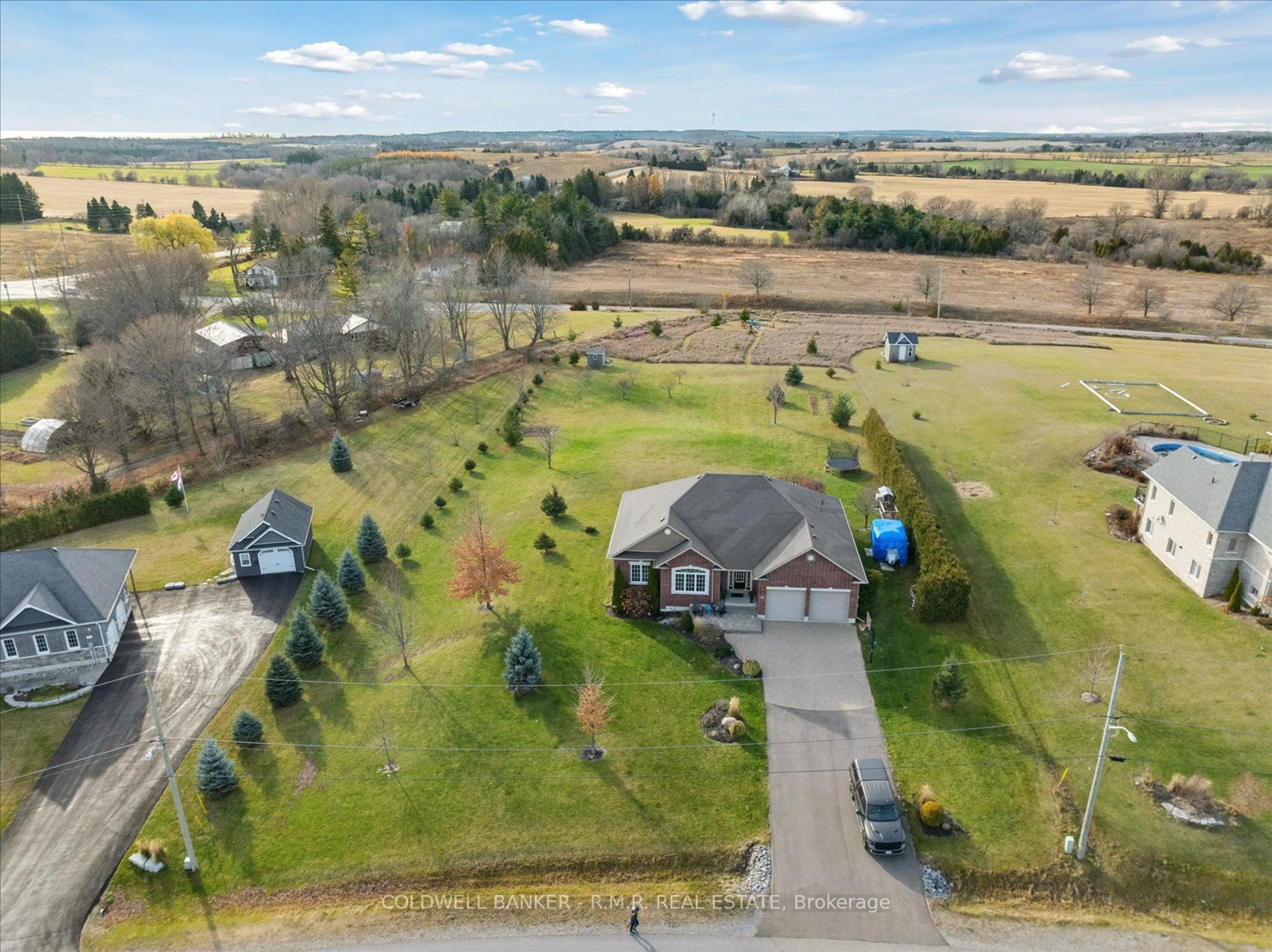 Frontside or backside of a home, the fenced backyard for 42 Jean Davey Rd, Hamilton Township Ontario K9A 0Y1