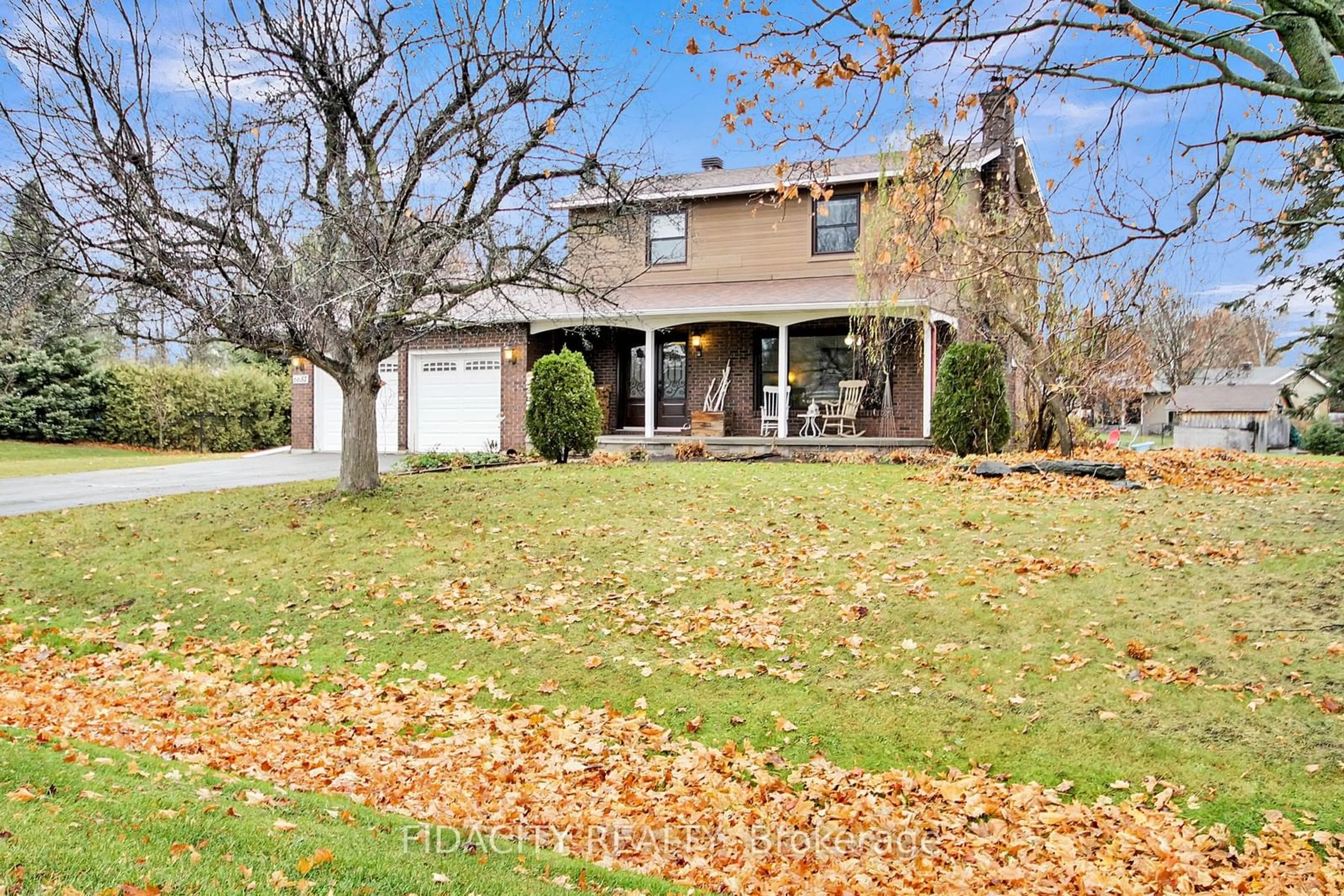 Frontside or backside of a home, the fenced backyard for 6657 Bluebird St, Manotick - Kars - Rideau Twp and Area Ontario K0A 2E0