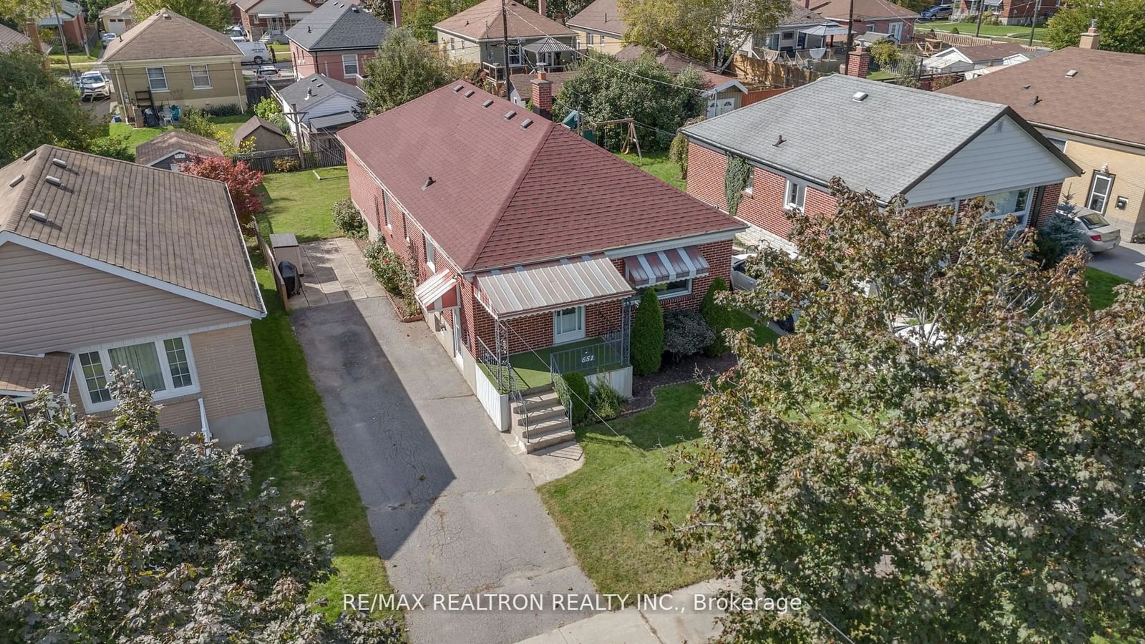 Frontside or backside of a home, the fenced backyard for 651 Chester St, Peterborough Ontario K9J 3B8