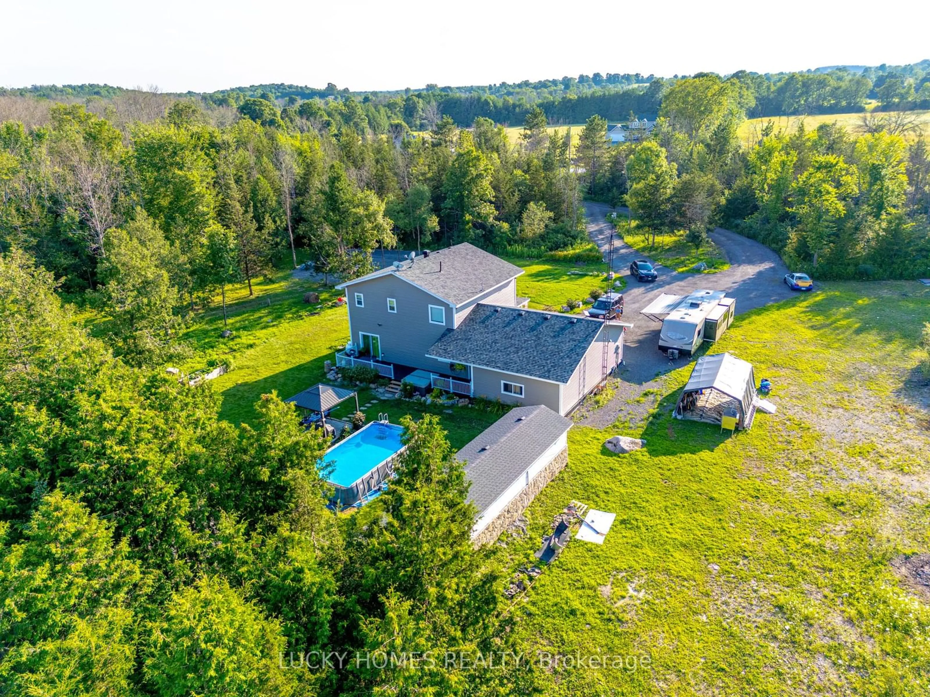 Frontside or backside of a home, the fenced backyard for 2916 Shannonville Rd, Tyendinaga Ontario K0K 2V0