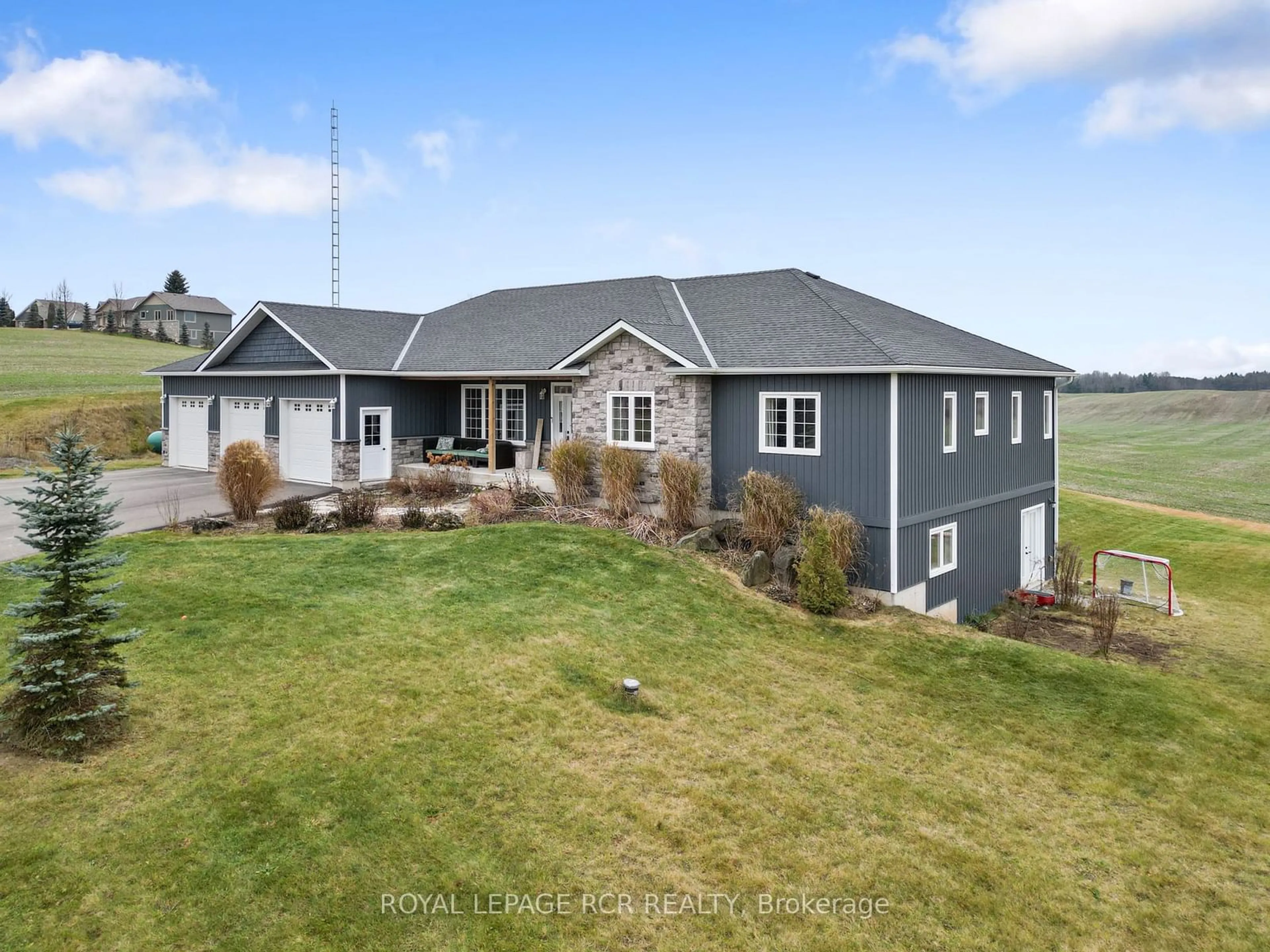 Frontside or backside of a home, the fenced backyard for 151116 12 Line, East Garafraxa Ontario L9W 7A8