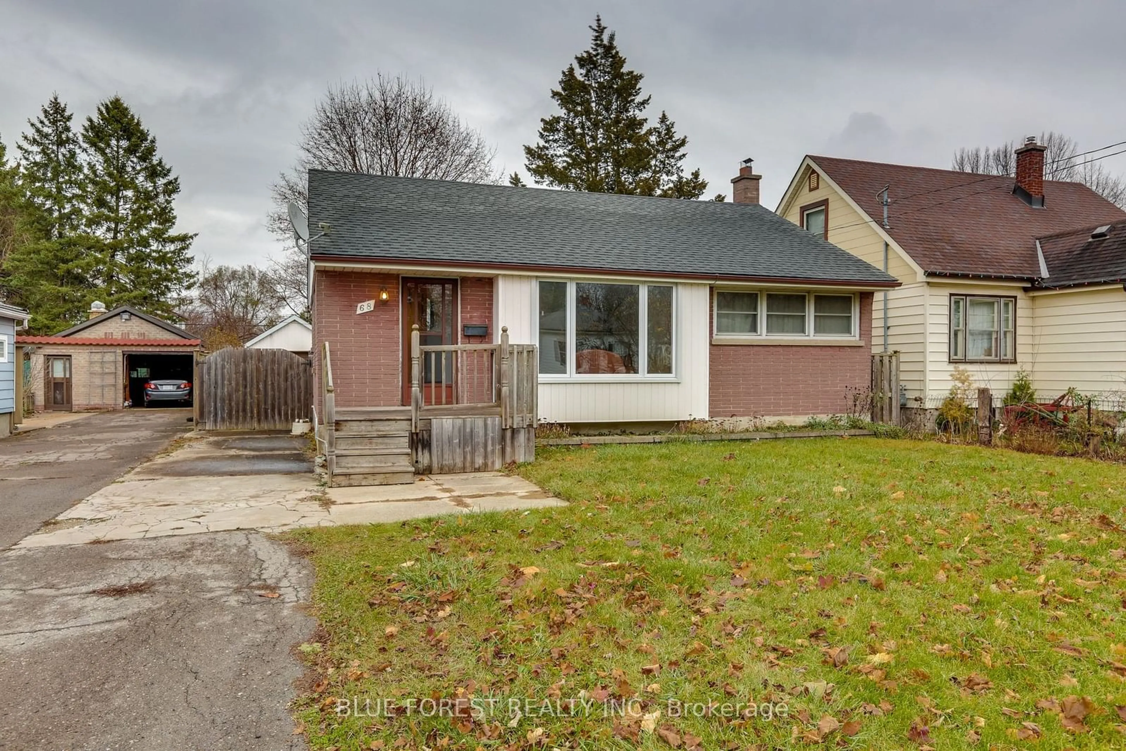 Frontside or backside of a home, the fenced backyard for 68 Mcnay St, London Ontario N5Y 1K7