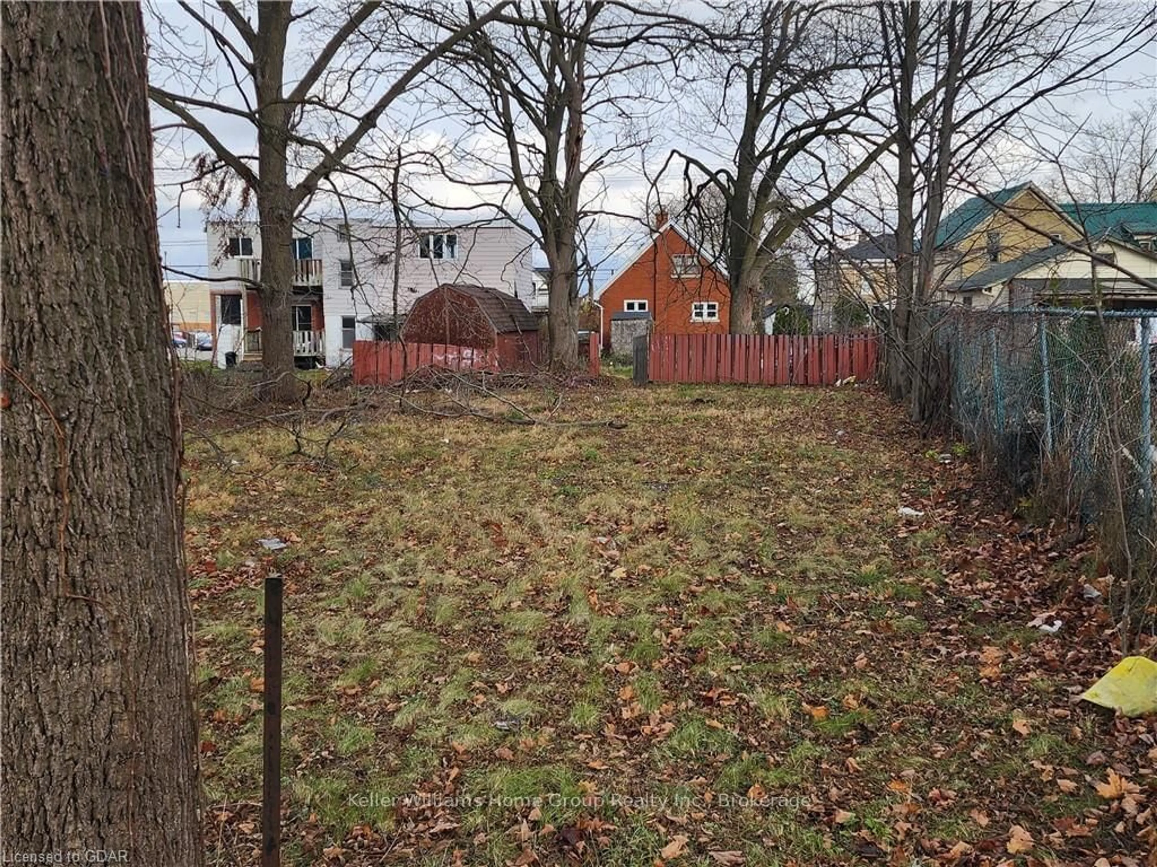 Frontside or backside of a home, the fenced backyard for 257 MILL St, Kitchener Ontario N2M 3R4