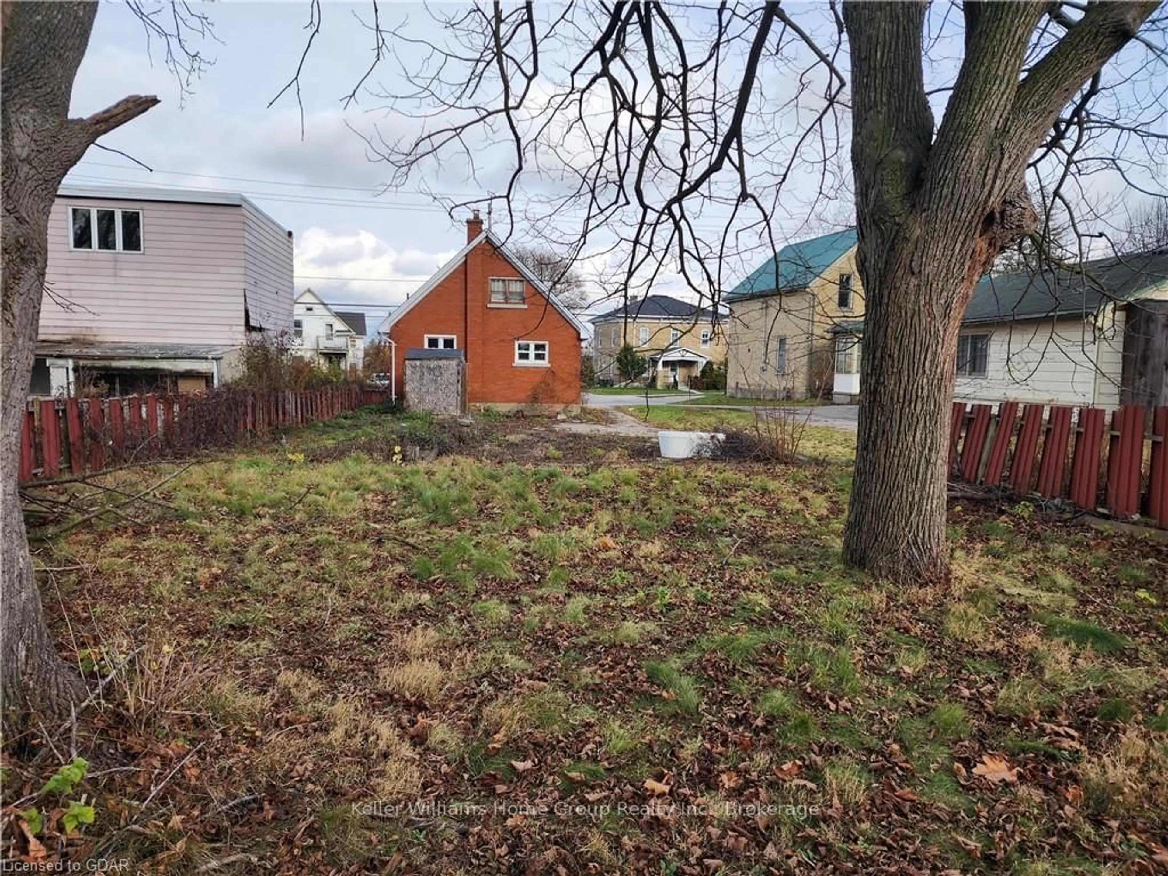 Frontside or backside of a home, the fenced backyard for 257 MILL St, Kitchener Ontario N2M 3R4