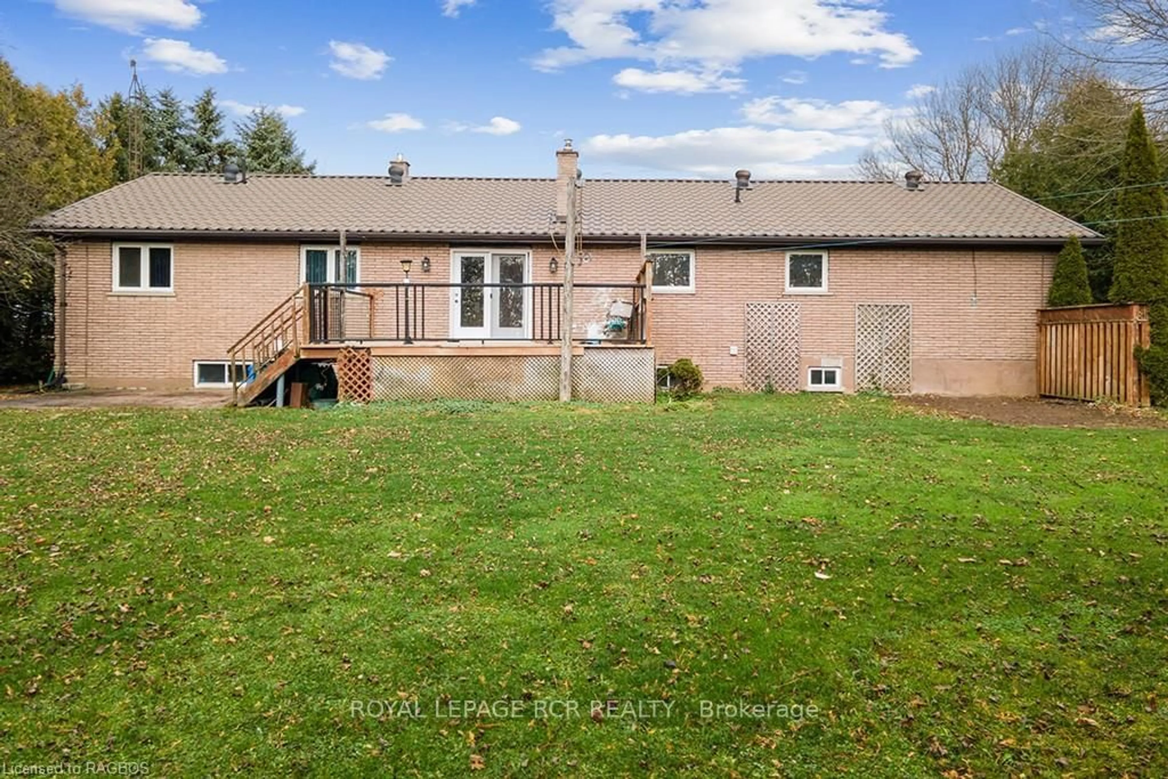 A pic from exterior of the house or condo, the fenced backyard for 733036 SOUTHGATE SIDEROAD 73, Southgate Ontario N0C 1L0