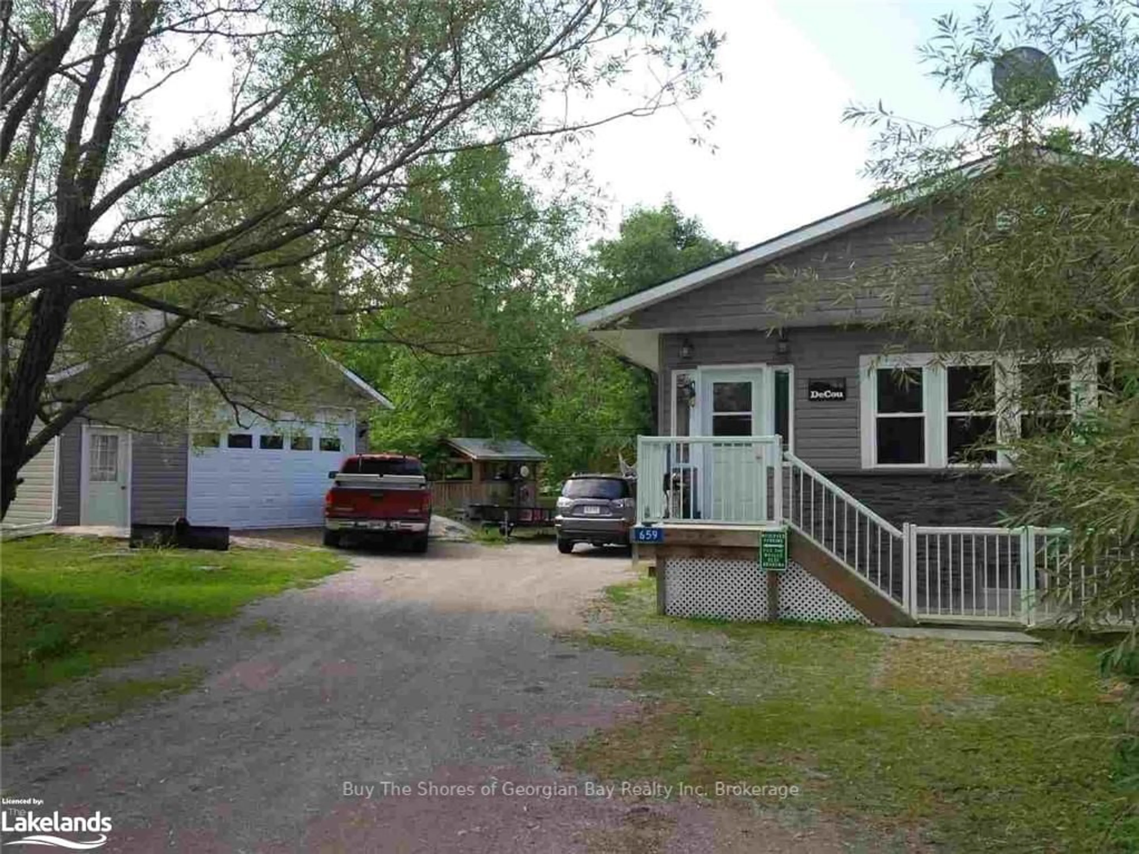 Frontside or backside of a home, cottage for 659 HONEY HARBOUR Rd, Georgian Bay Ontario L0K 1S0