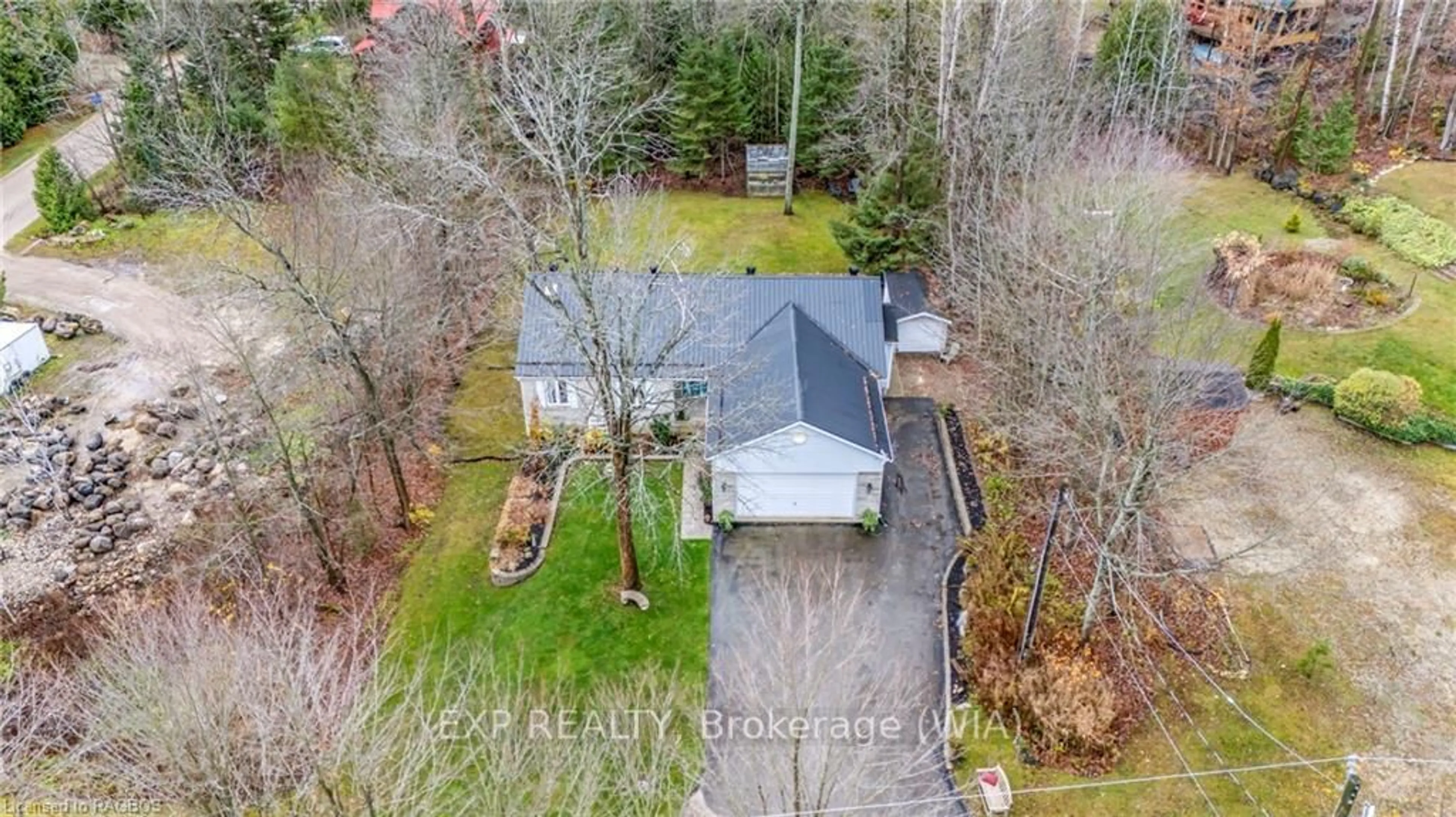 Frontside or backside of a home, the fenced backyard for 5 15TH Ave, South Bruce Peninsula Ontario N0H 2T0