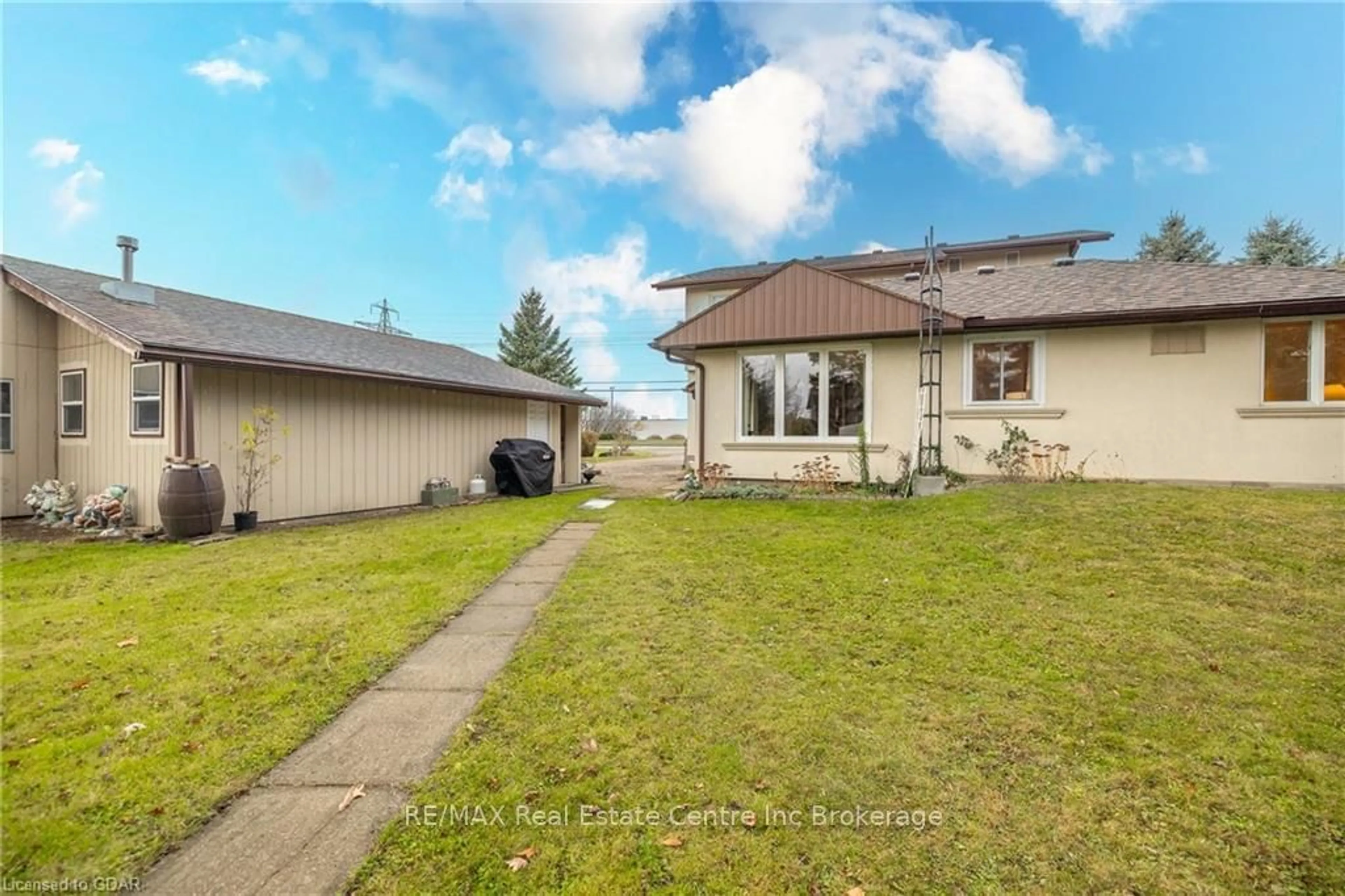 Frontside or backside of a home, the fenced backyard for 7147 WELLINGTON ROAD NO. 124 Rd, Guelph/Eramosa Ontario N1H 6J3