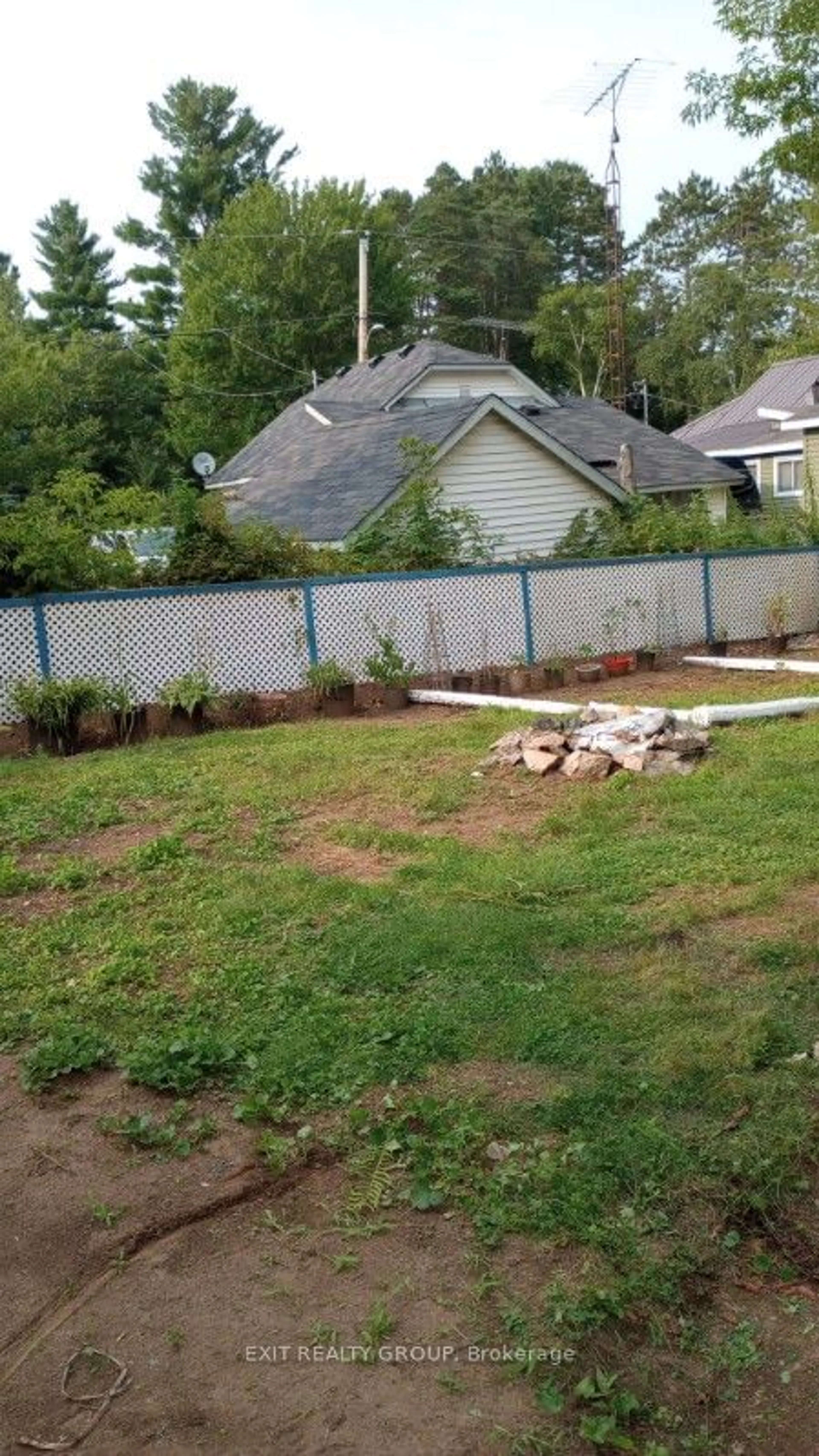 Frontside or backside of a home, the fenced backyard for 33 Glastonbury Rd, Addington Highlands Ontario K0H 2G0