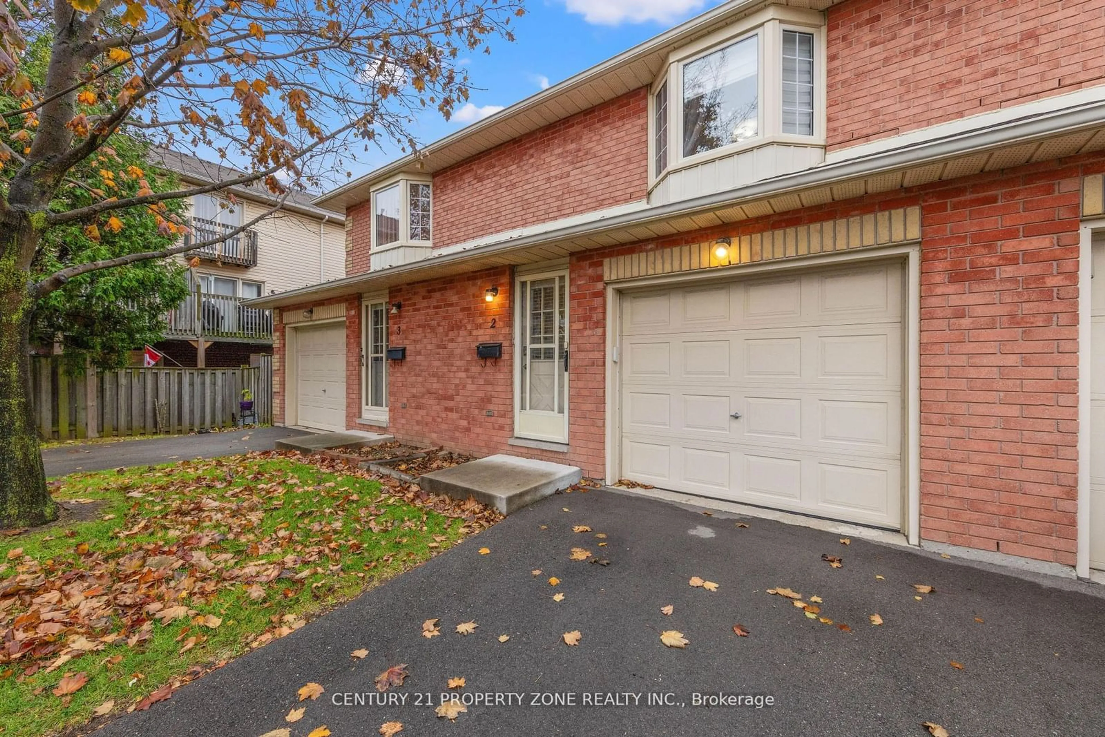 A pic from exterior of the house or condo, the fenced backyard for 280 Limeridge Rd #2, Hamilton Ontario L9A 2S7