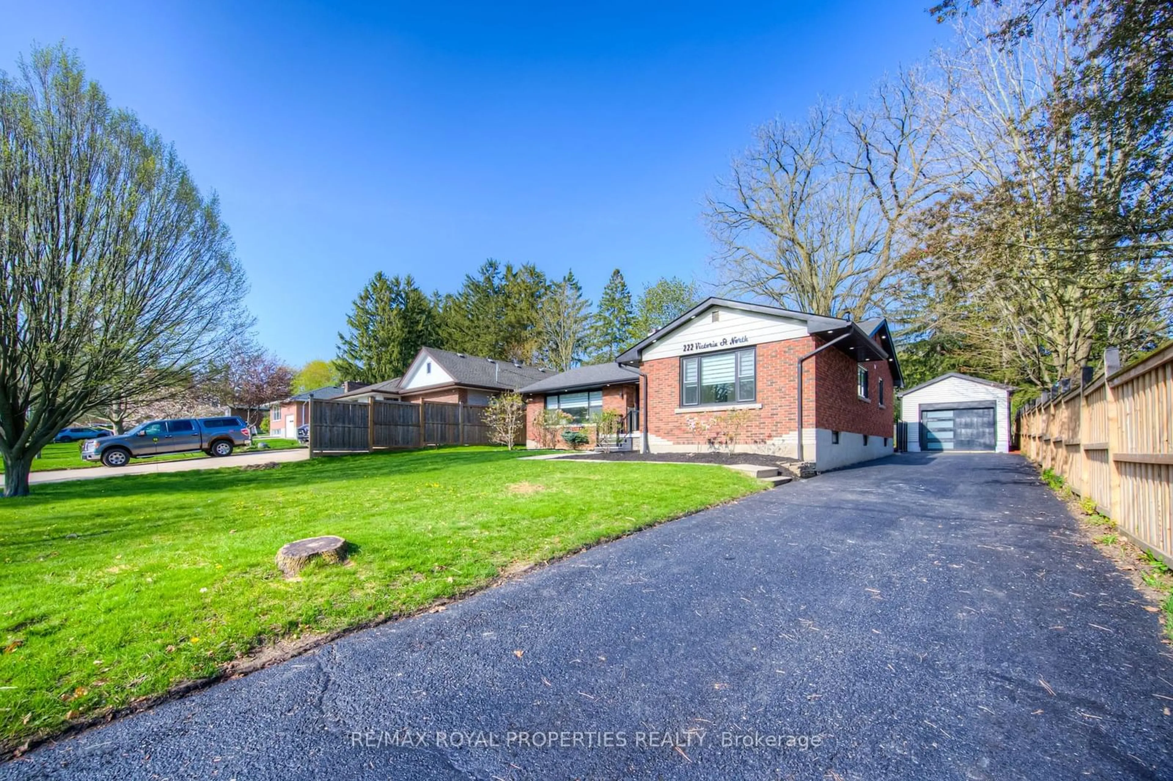 Frontside or backside of a home, the fenced backyard for 222 Victoria St, Woodstock Ontario N4S 6W3