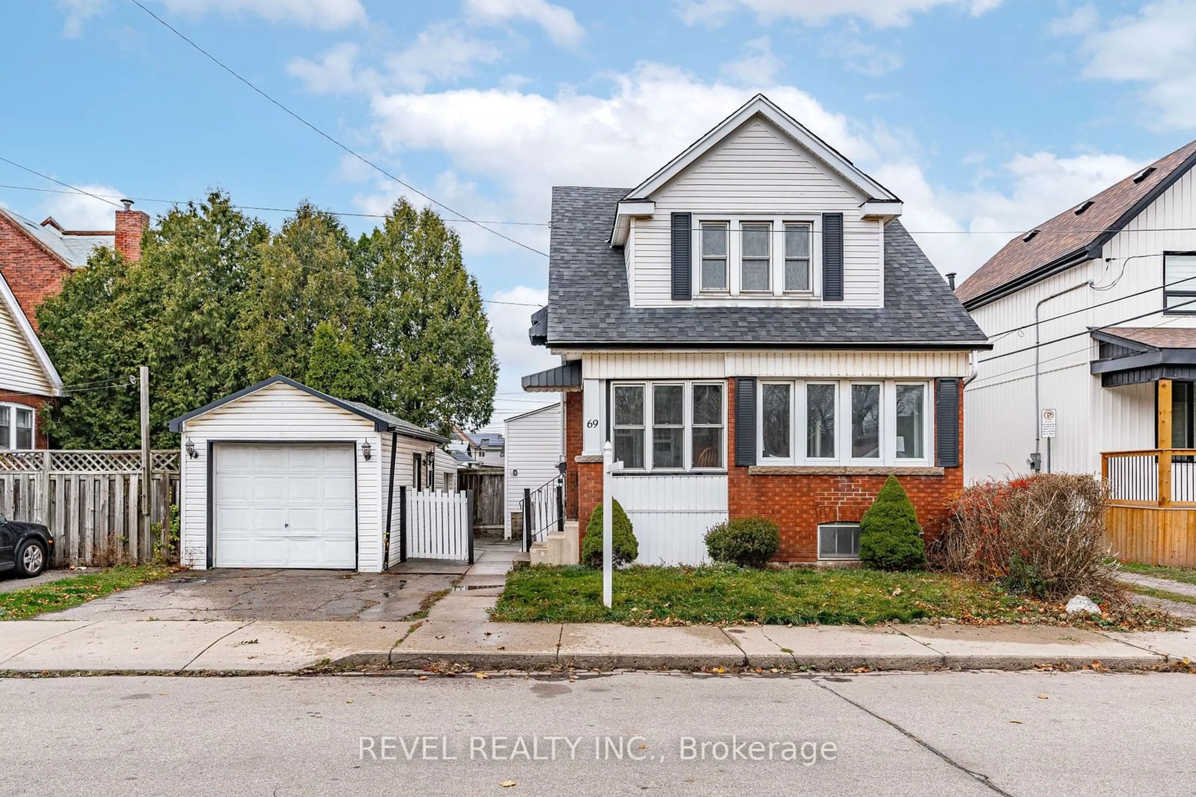 Frontside or backside of a home, the street view for 69 Roxborough Ave, Hamilton Ontario L8L 1Y2