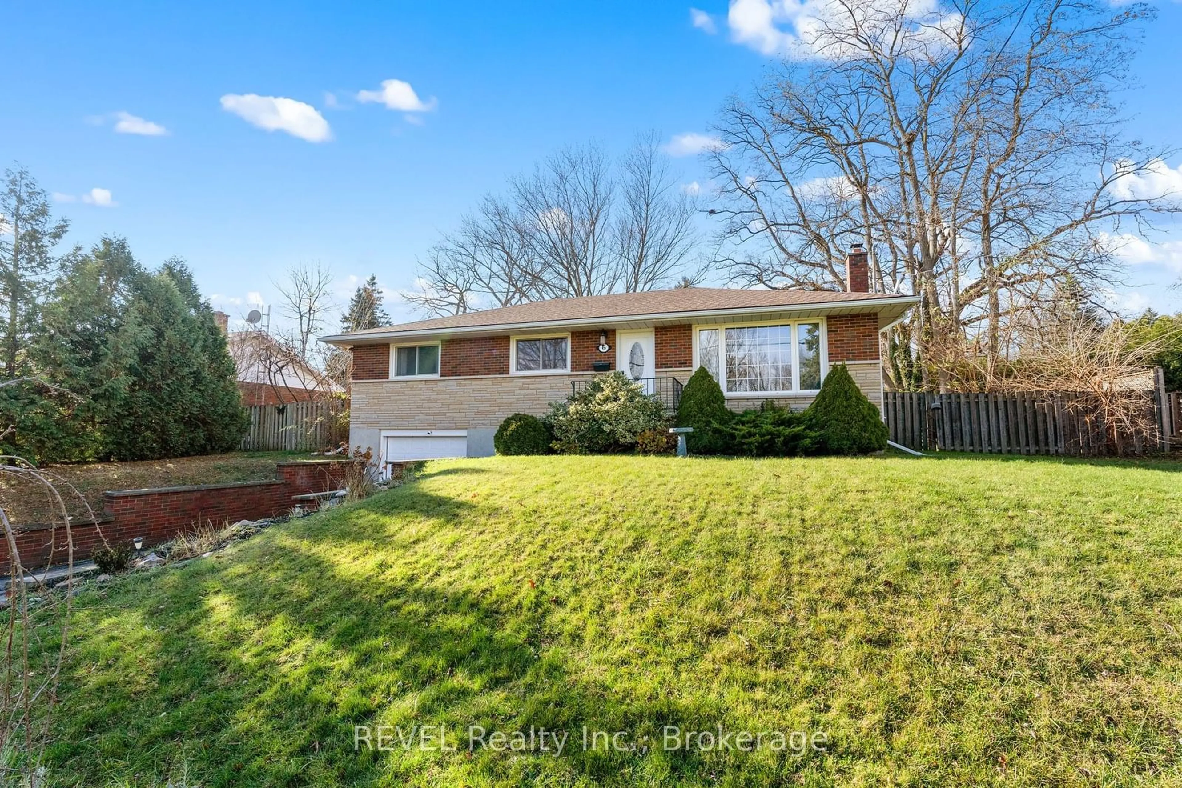 Frontside or backside of a home, the fenced backyard for 6 Stella St, Pelham Ontario L0S 1E0