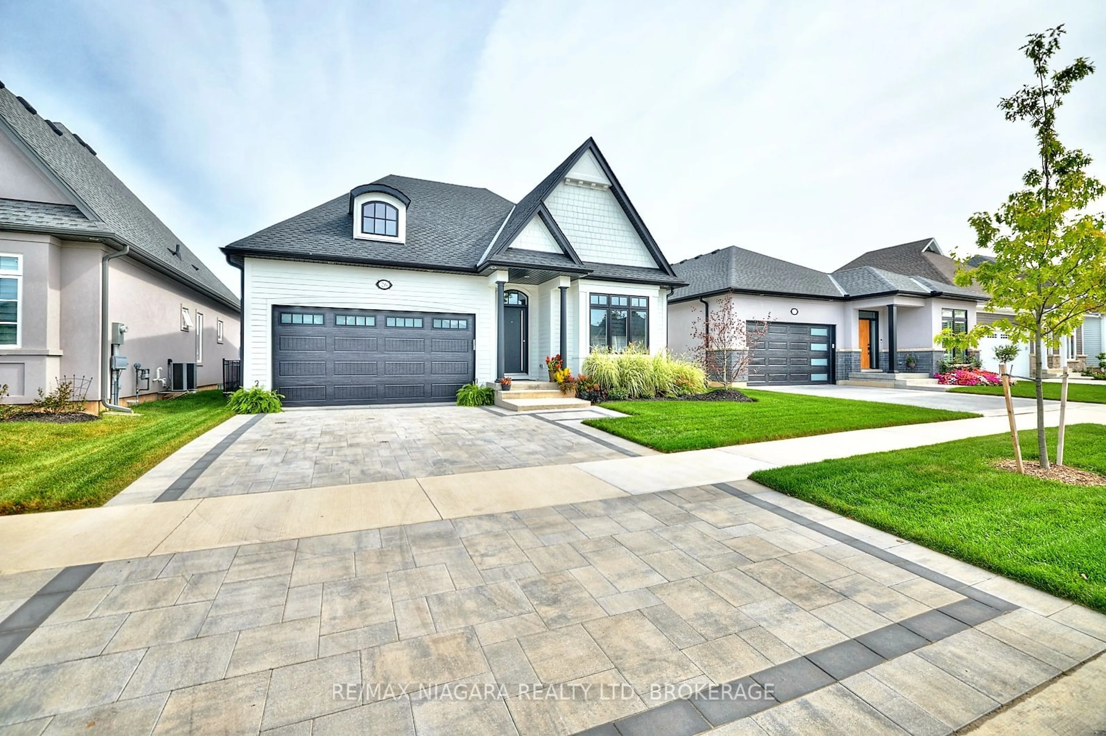 Frontside or backside of a home, the street view for 26 Sunrise Crt, Fort Erie Ontario L0S 1N0