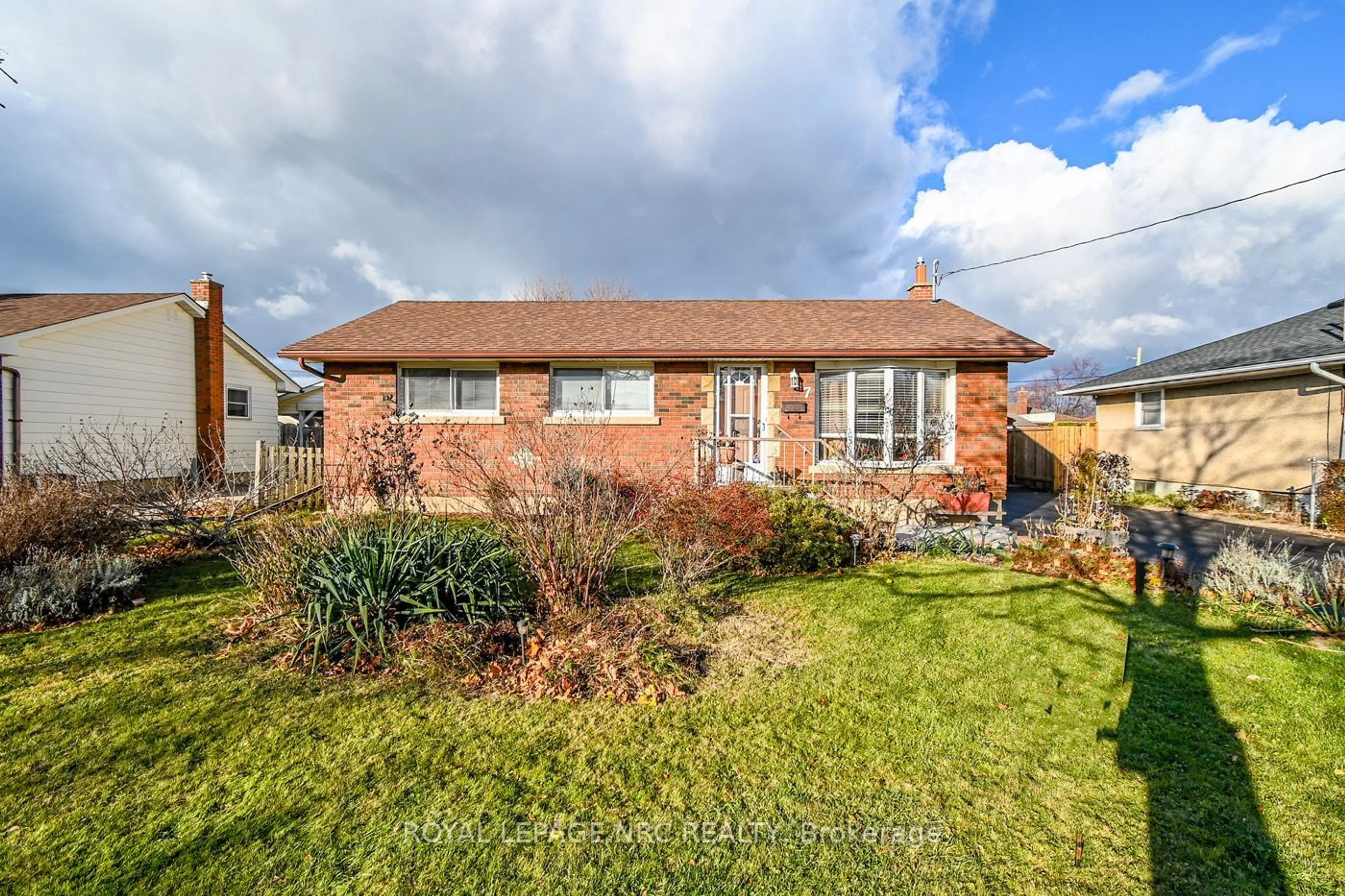 Frontside or backside of a home, the fenced backyard for 7 Ridgeview Ave, St. Catharines Ontario L2M 6B2