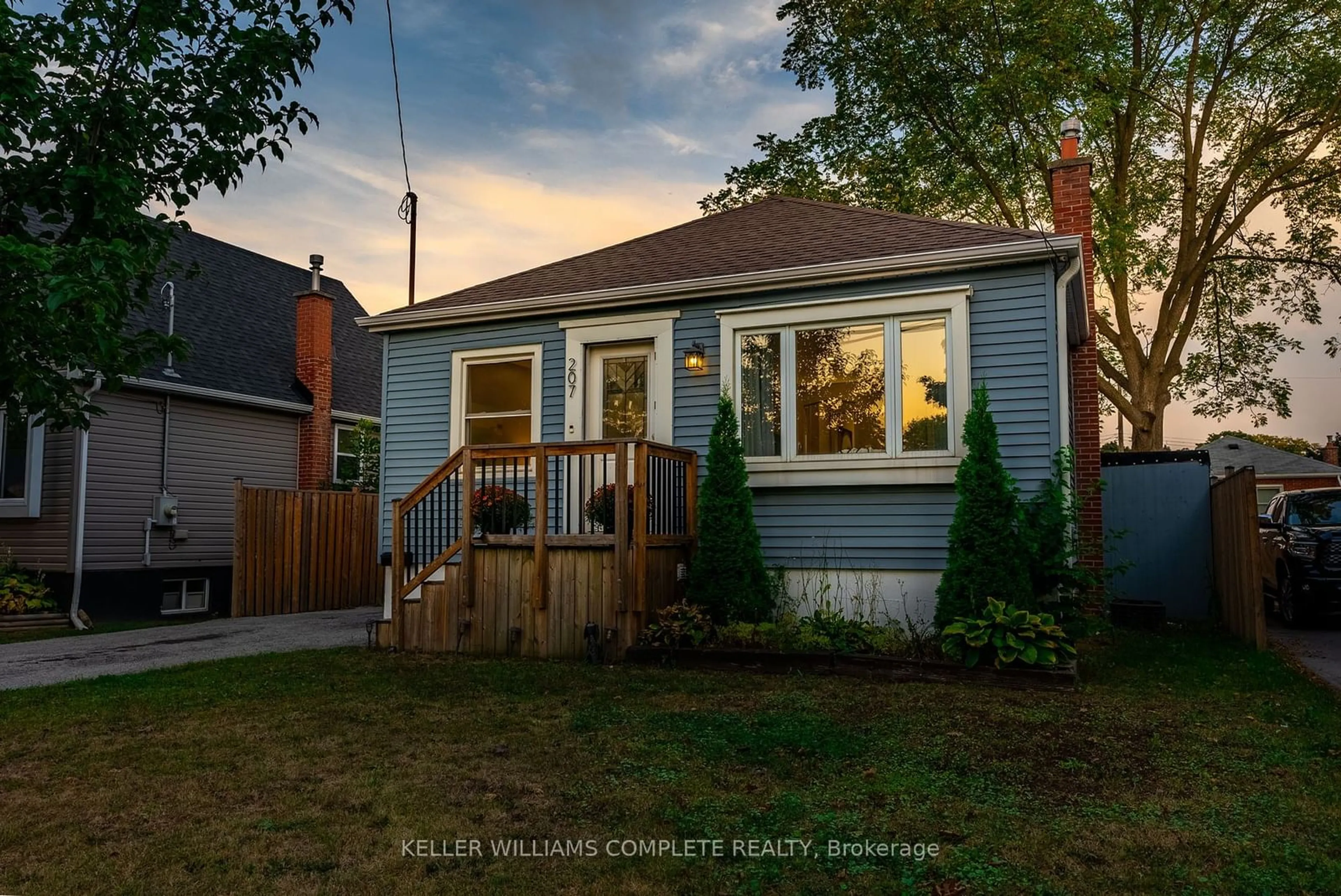 Frontside or backside of a home, the fenced backyard for 207 East 33rd St, Hamilton Ontario L8V 3T7