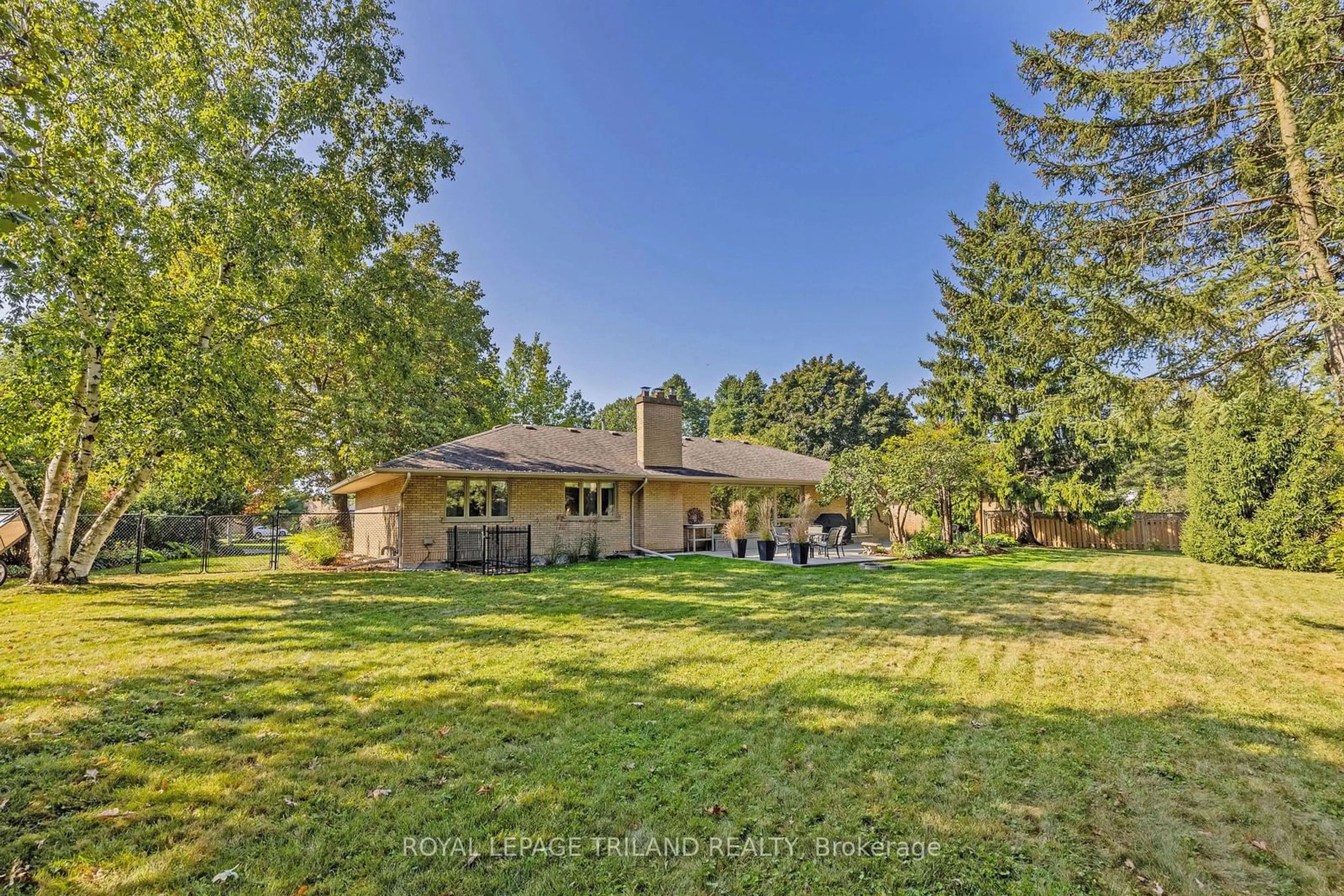 A pic from exterior of the house or condo, the fenced backyard for 71 Kingsford Cres, London Ontario N6C 4E5