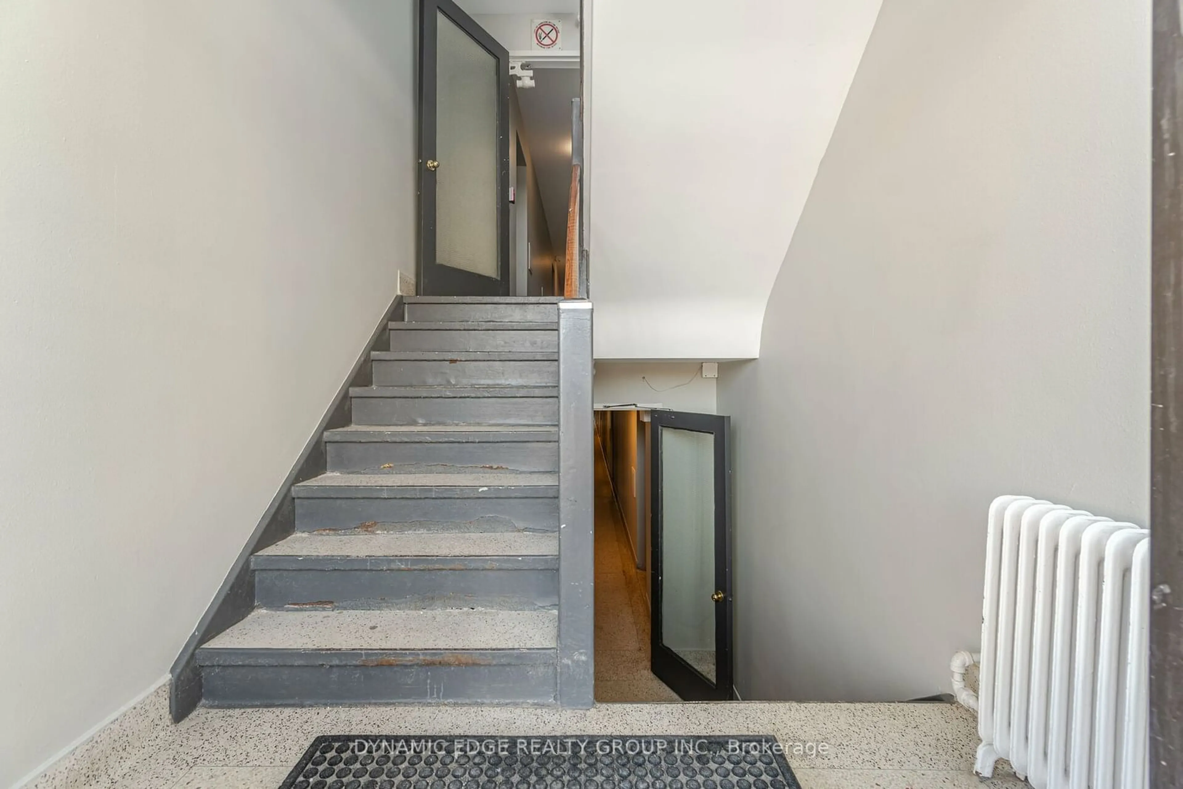 Indoor foyer, cement floor for 57 Mericourt Rd #103, Hamilton Ontario L8S 2N5