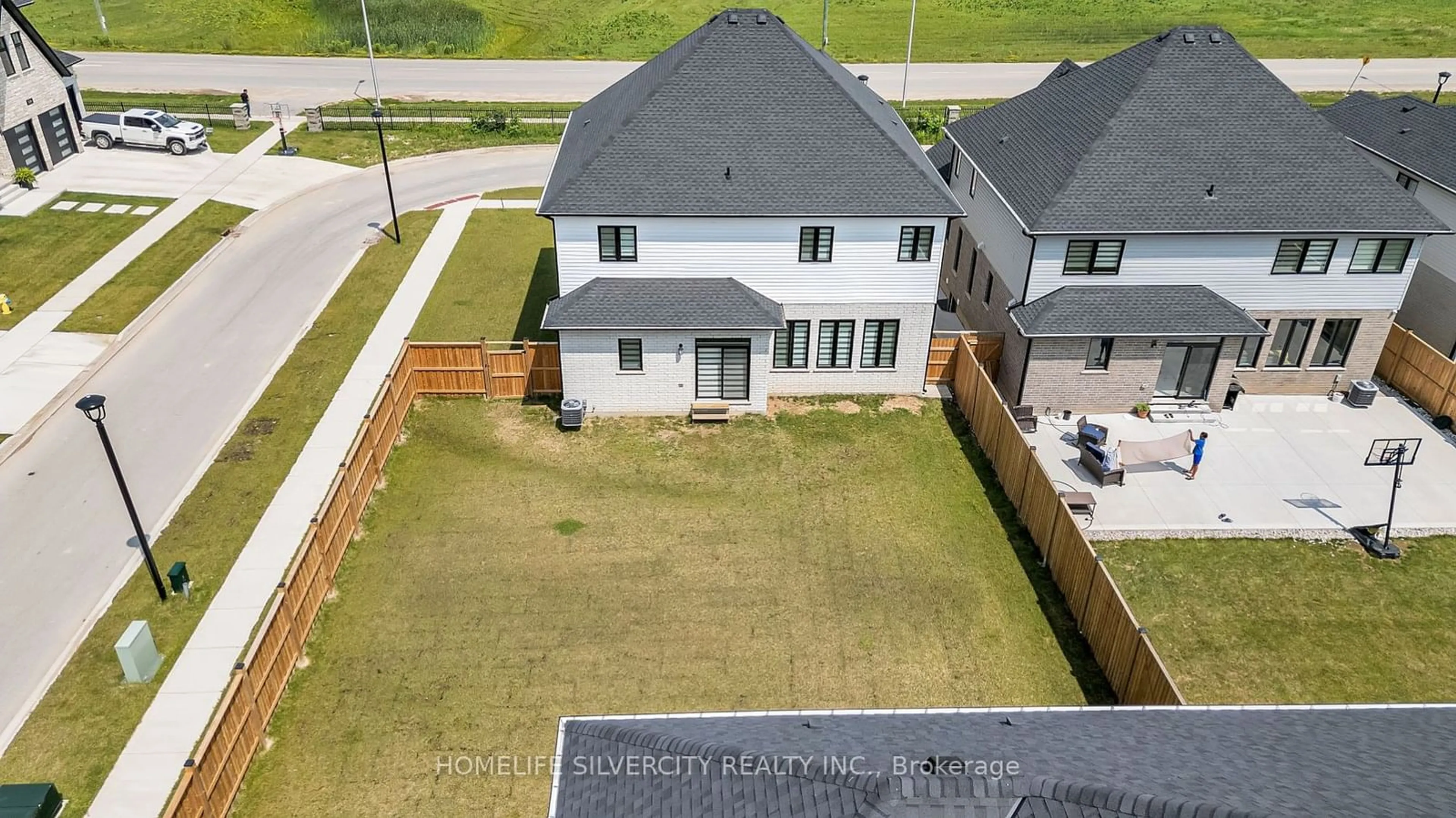 Frontside or backside of a home, the fenced backyard for 7213 Silver Creek Circ, London Ontario N6P 0G9