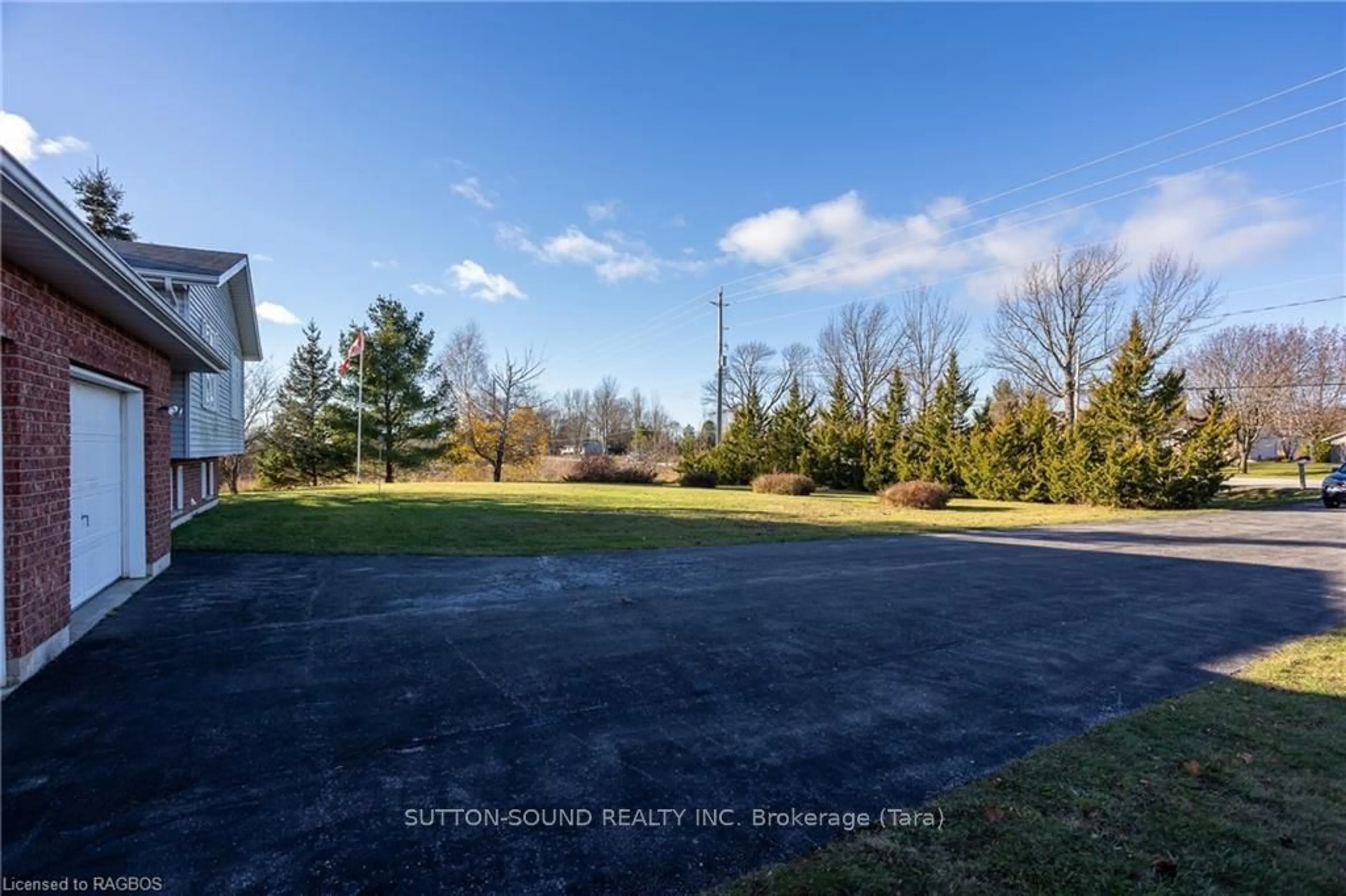 Frontside or backside of a home, the fenced backyard for 401142 GREY RD 17, Georgian Bluffs Ontario N0H 2T0