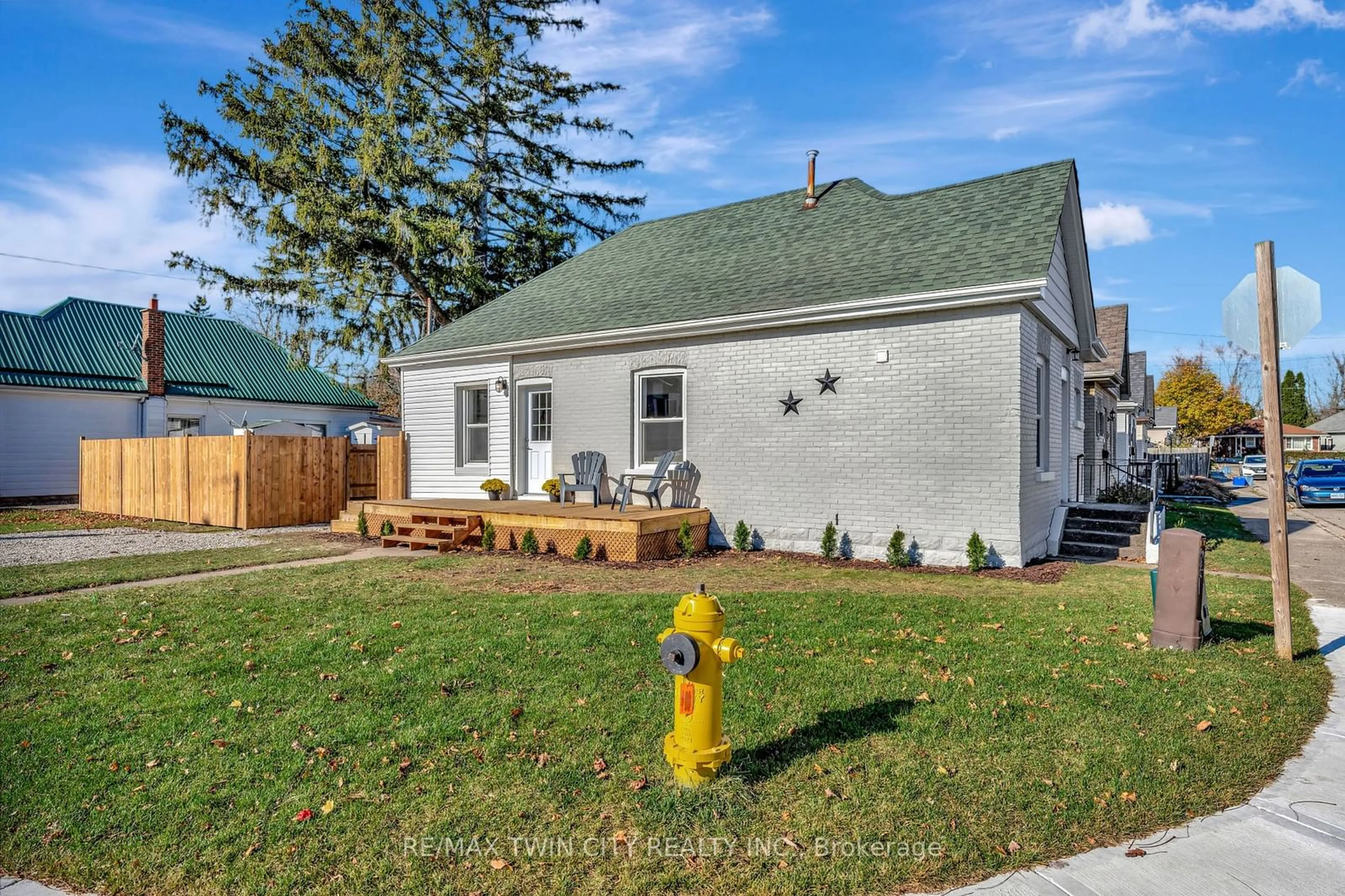 Frontside or backside of a home, the fenced backyard for 15 Gordon St, Brantford Ontario N3S 2M7