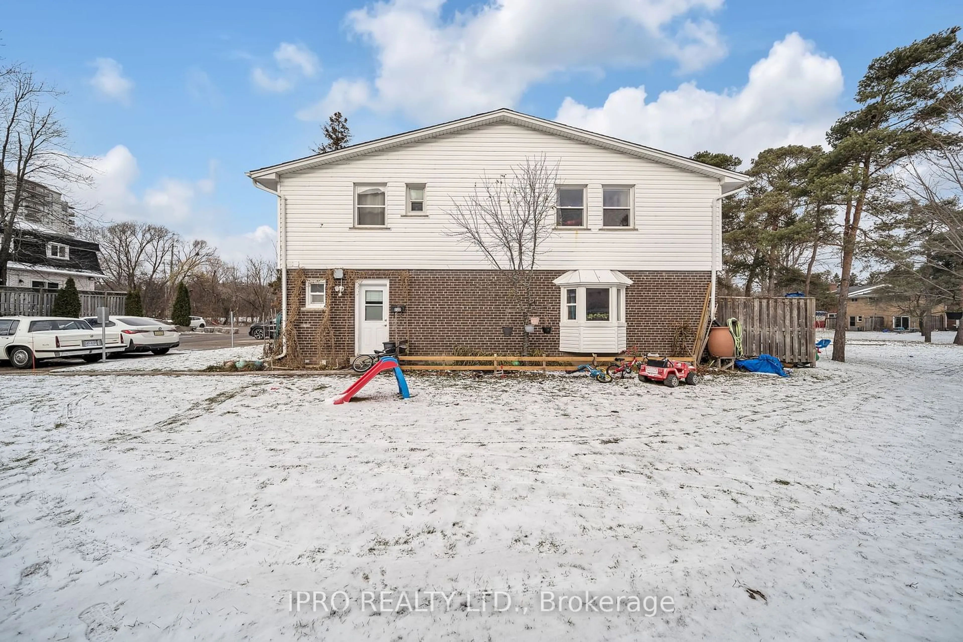 Frontside or backside of a home, the fenced backyard for 272 Westcourt Pl, Waterloo Ontario N2L 2R7