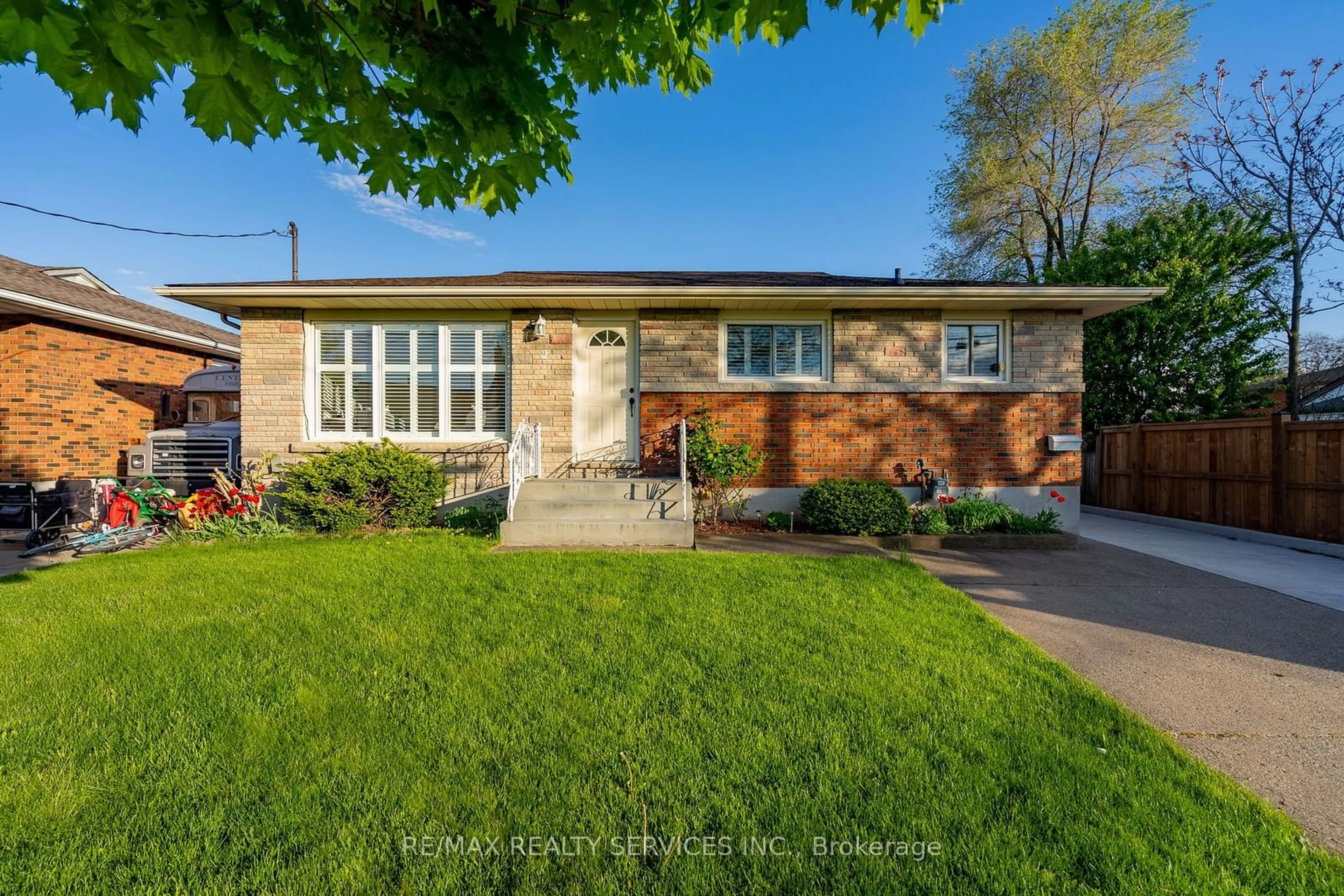 Frontside or backside of a home, the fenced backyard for 2 Anderson St, St. Catharines Ontario L2M 5C9