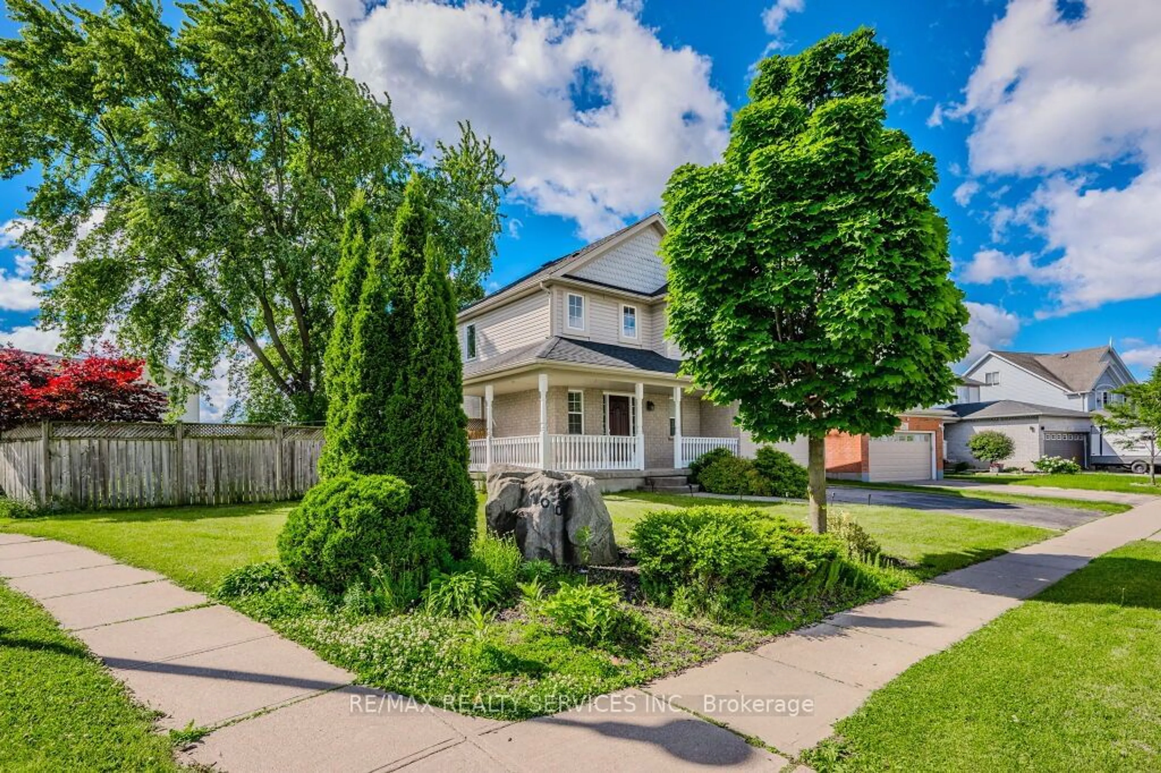 Frontside or backside of a home, the fenced backyard for 100 Acorn Way, Cambridge Ontario N1R 8M7