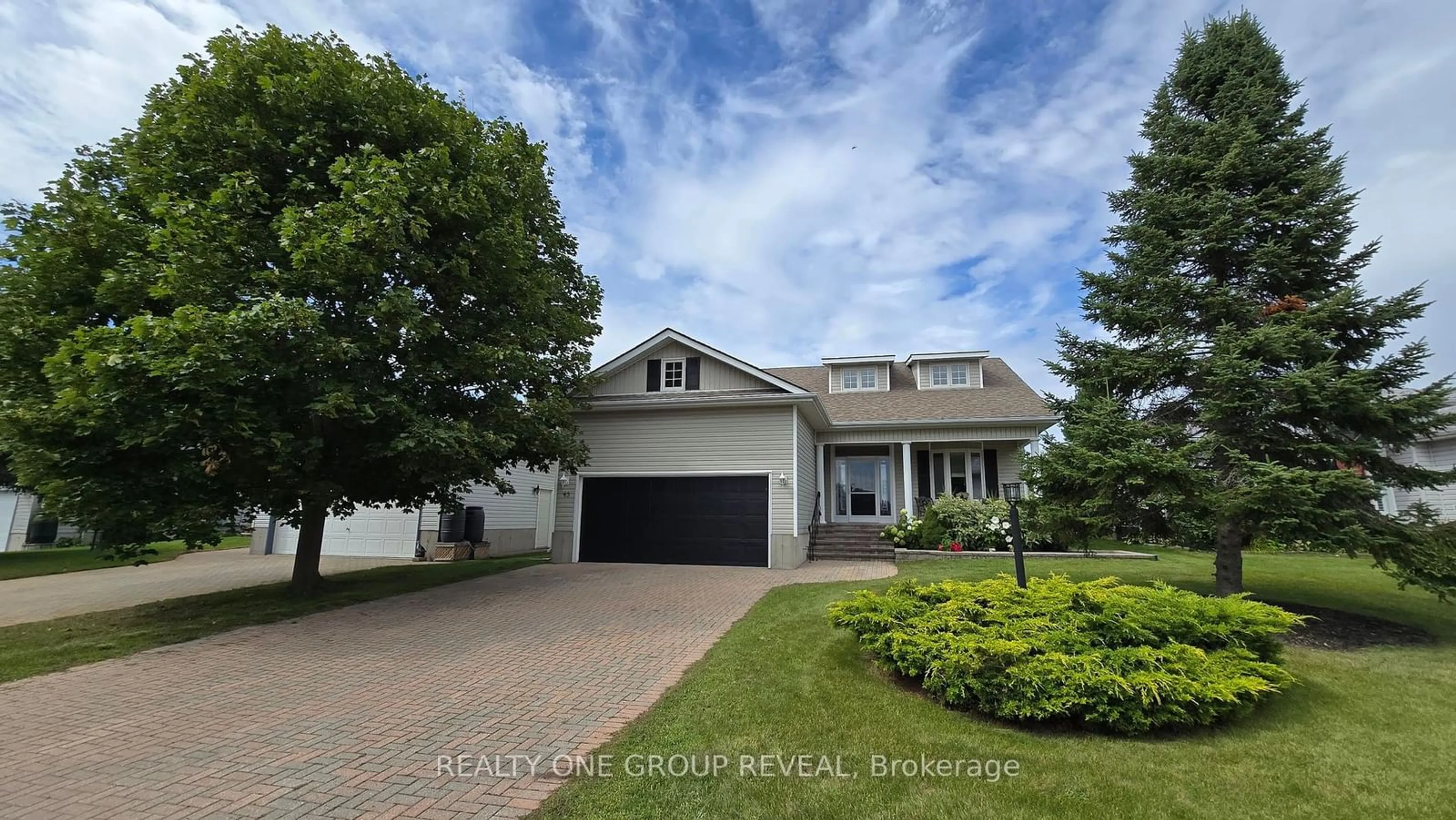 Frontside or backside of a home, the street view for 45 Elmdale Dr, Prince Edward County Ontario K0K 3L0