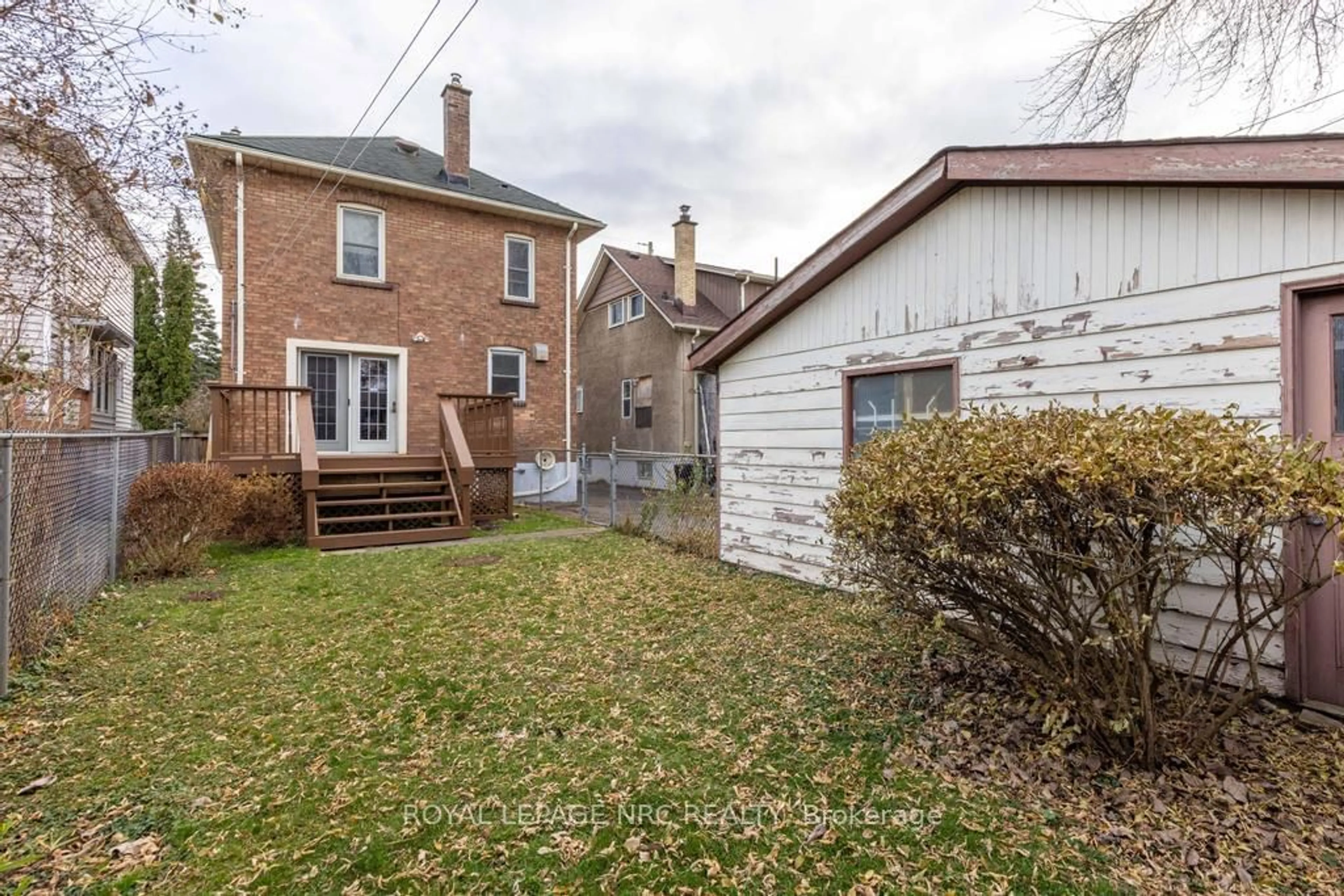 Frontside or backside of a home, the fenced backyard for 7 Chaplin Ave, St. Catharines Ontario L2R 2E4