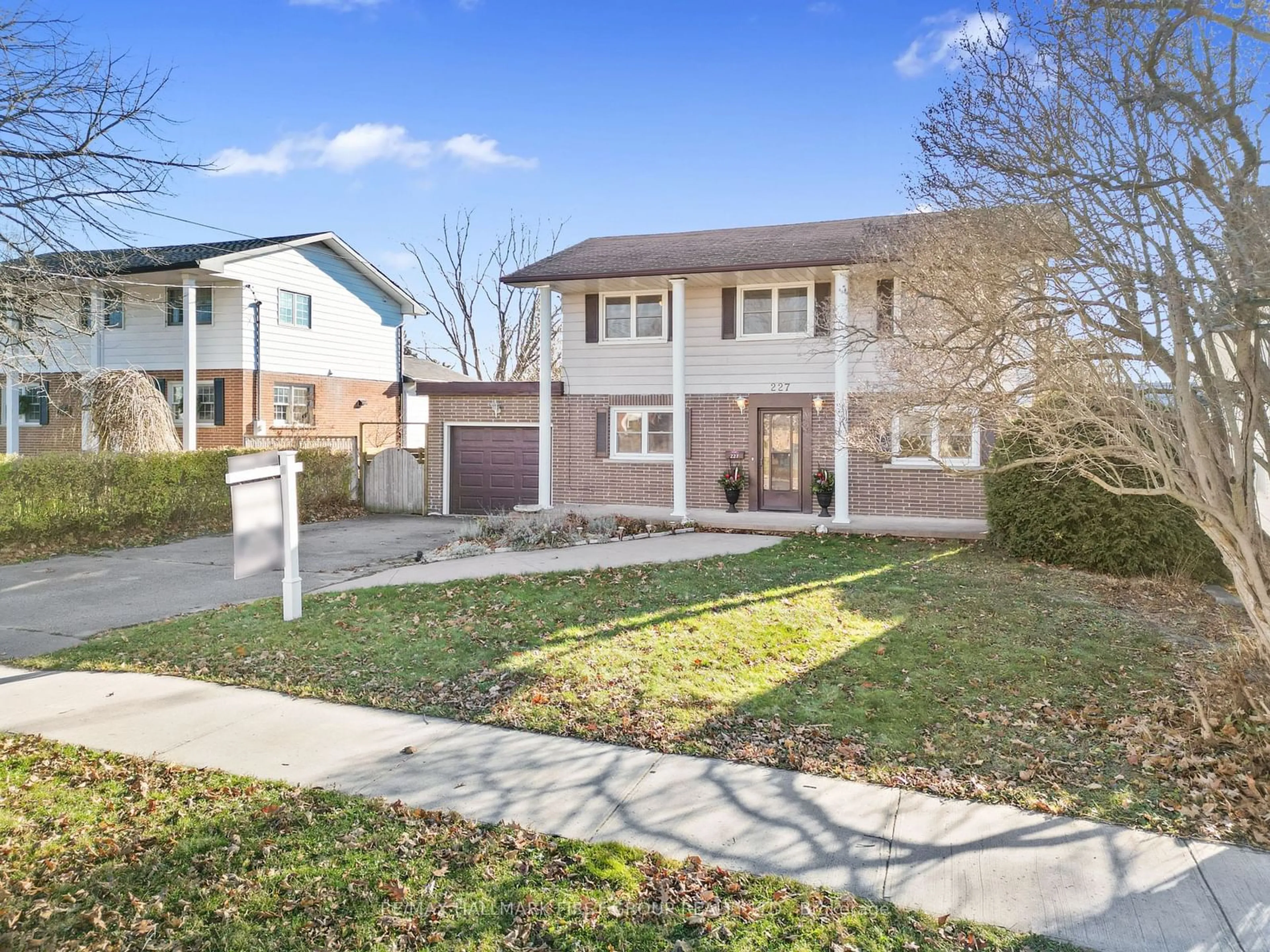 Frontside or backside of a home, the fenced backyard for 227 Queen St, Cobourg Ontario K9A 1N4