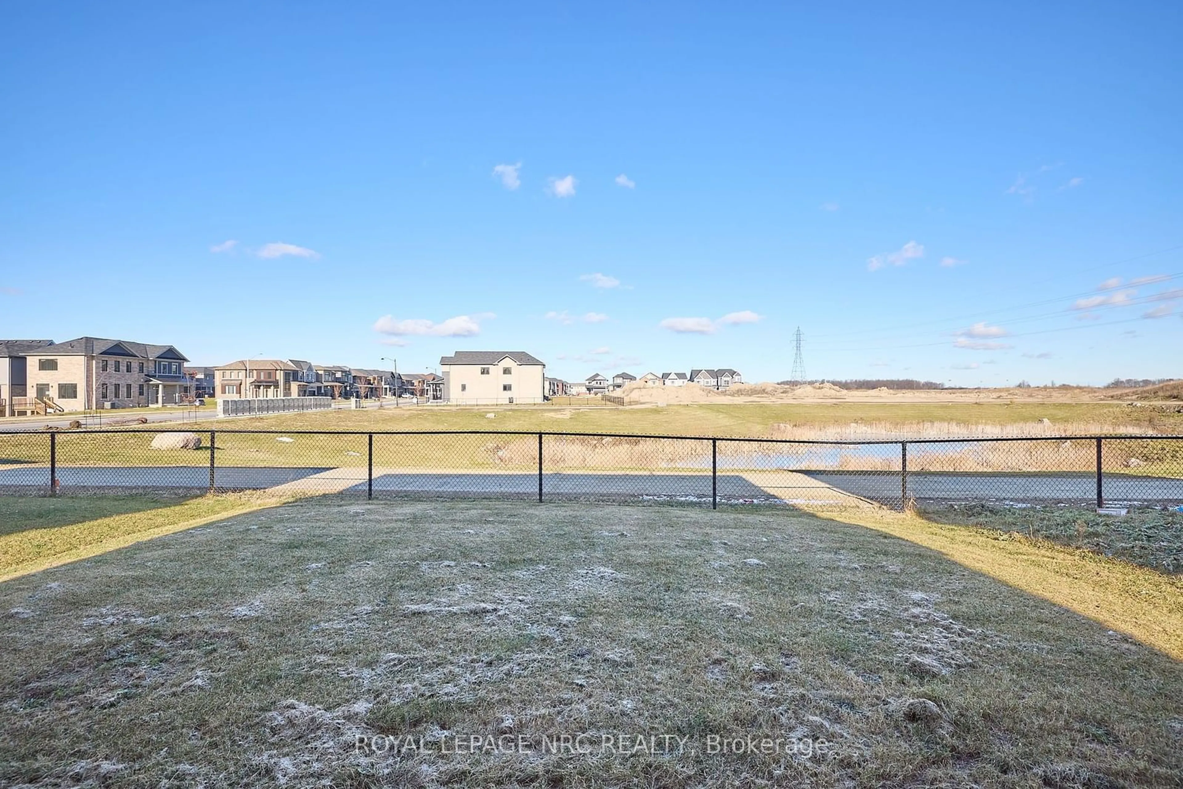 A pic from exterior of the house or condo, the fenced backyard for 10 Peach St, Thorold Ontario L2V 0K1