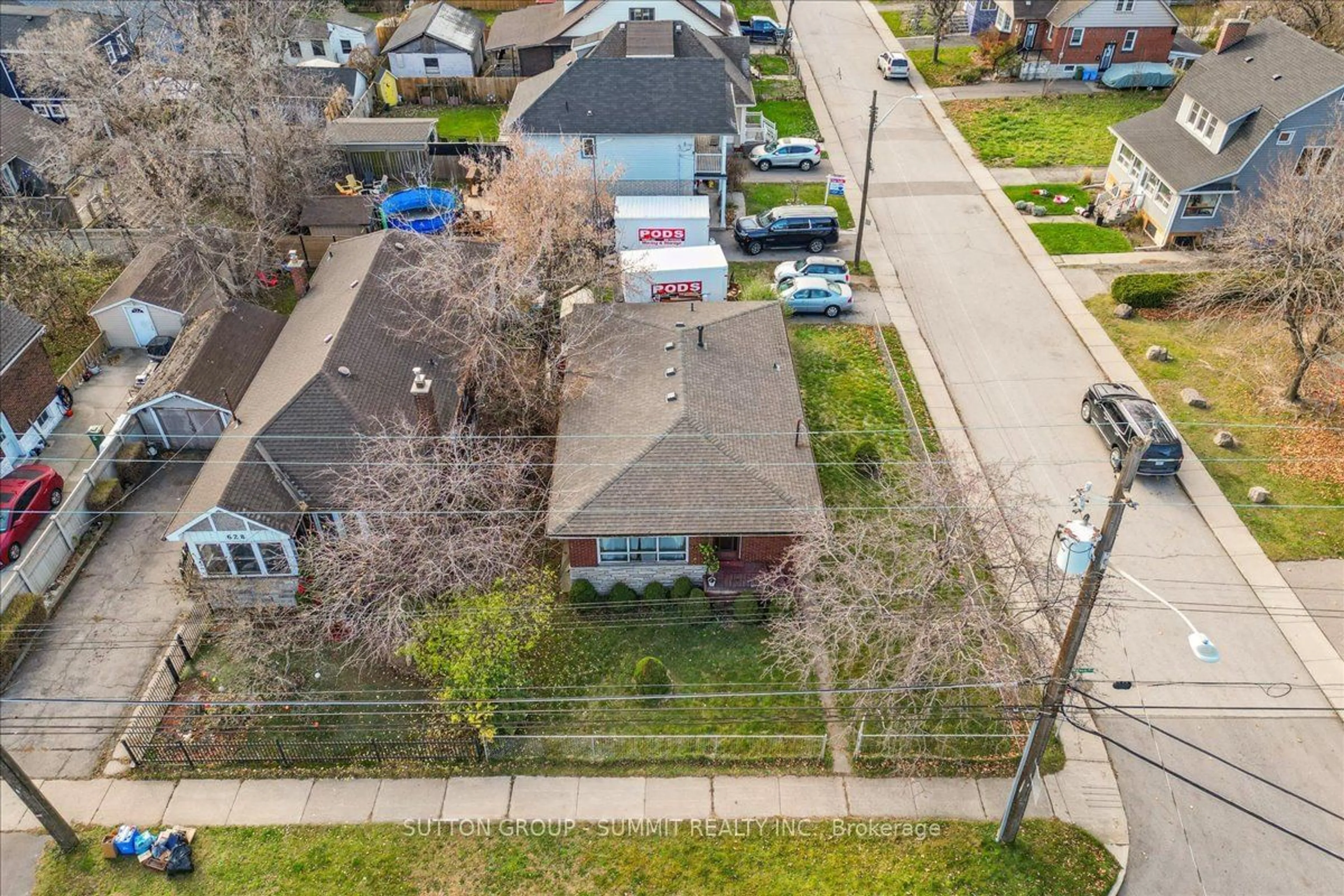 A pic from exterior of the house or condo, the fenced backyard for 632 Beach Blvd, Hamilton Ontario L8H 6Y1