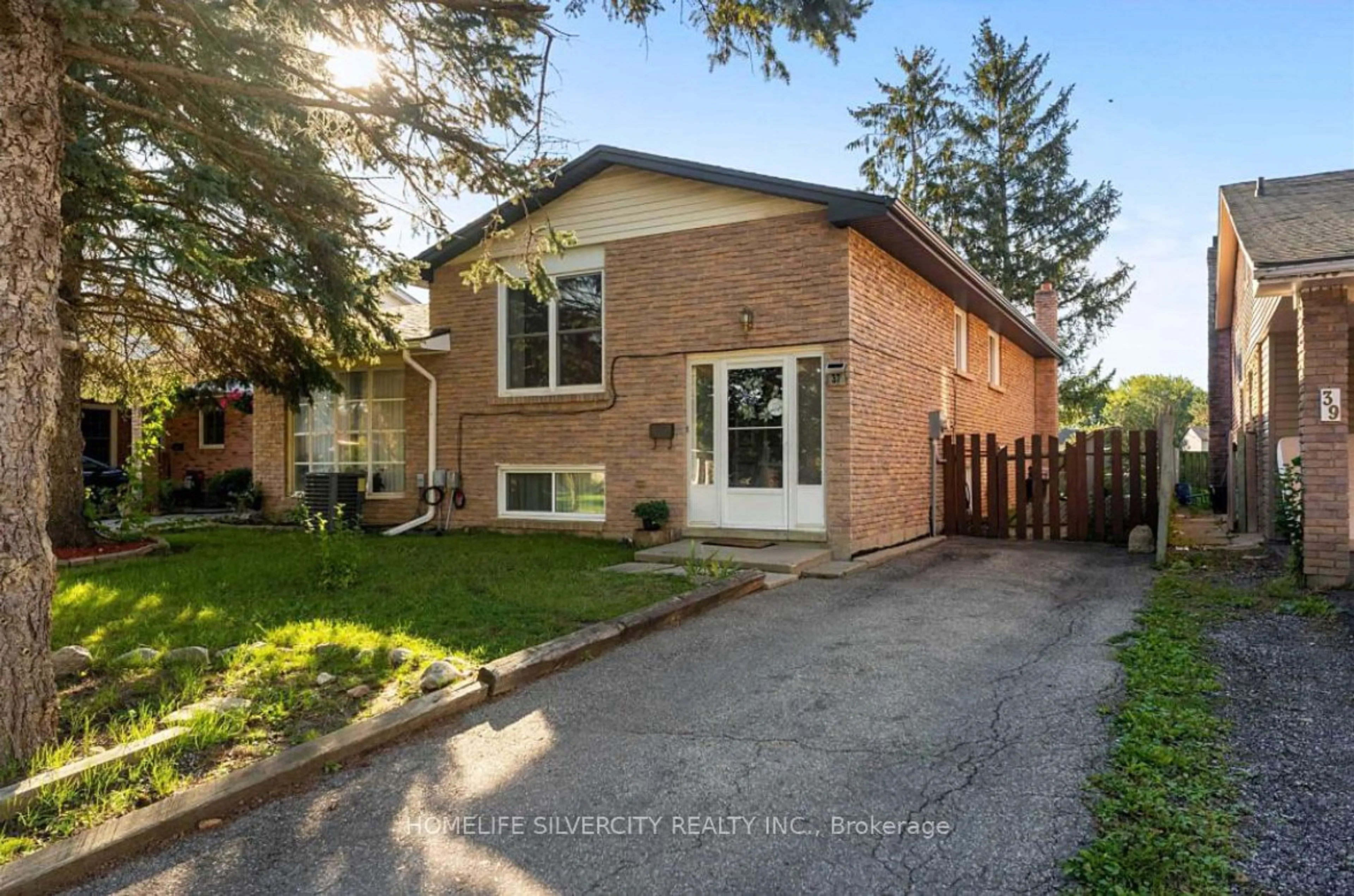 A pic from exterior of the house or condo, the fenced backyard for 37 Autumn Rd, Brantford Ontario N3R 7B1