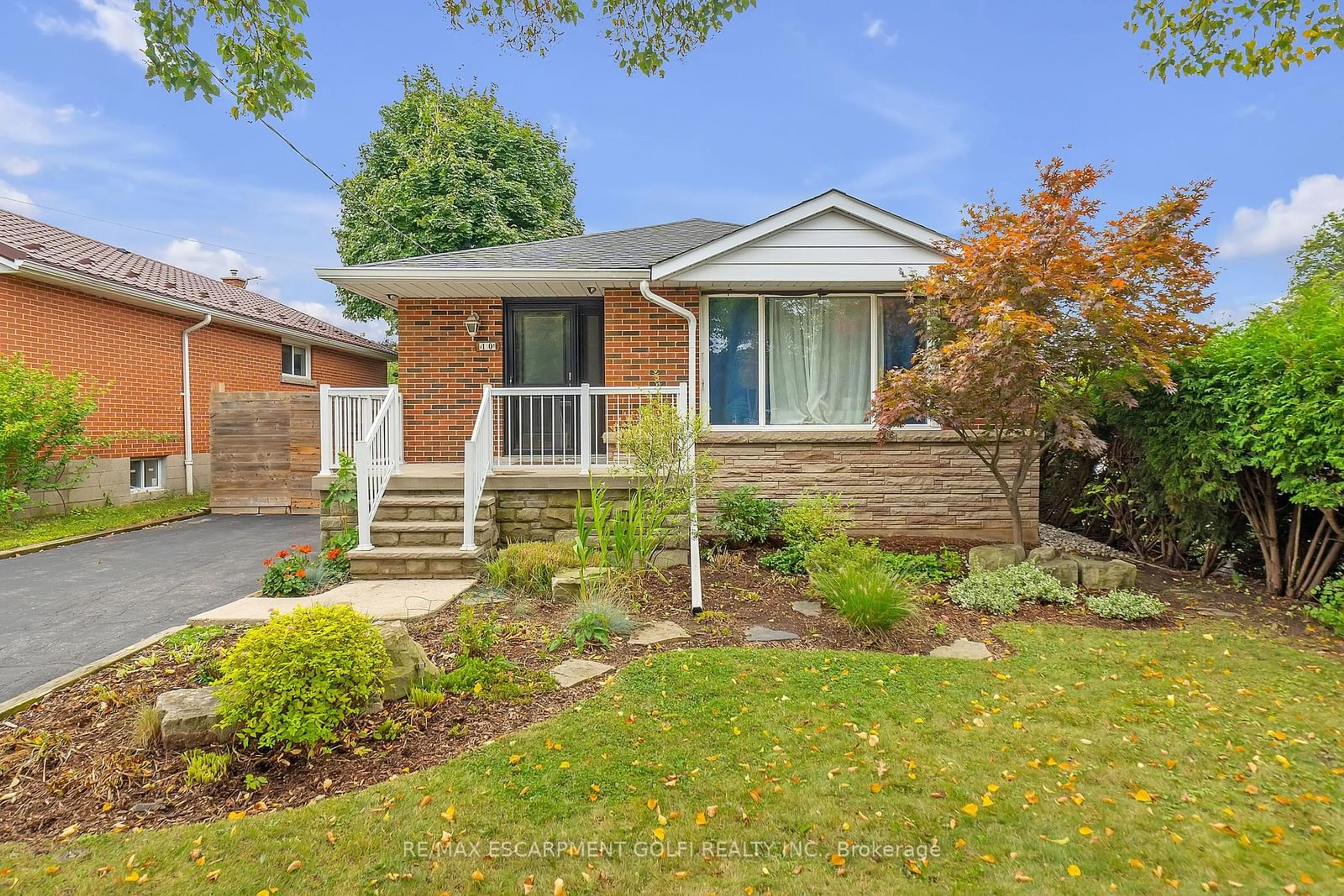 Frontside or backside of a home, the fenced backyard for 10 Warren Ave, Hamilton Ontario L9A 3C6