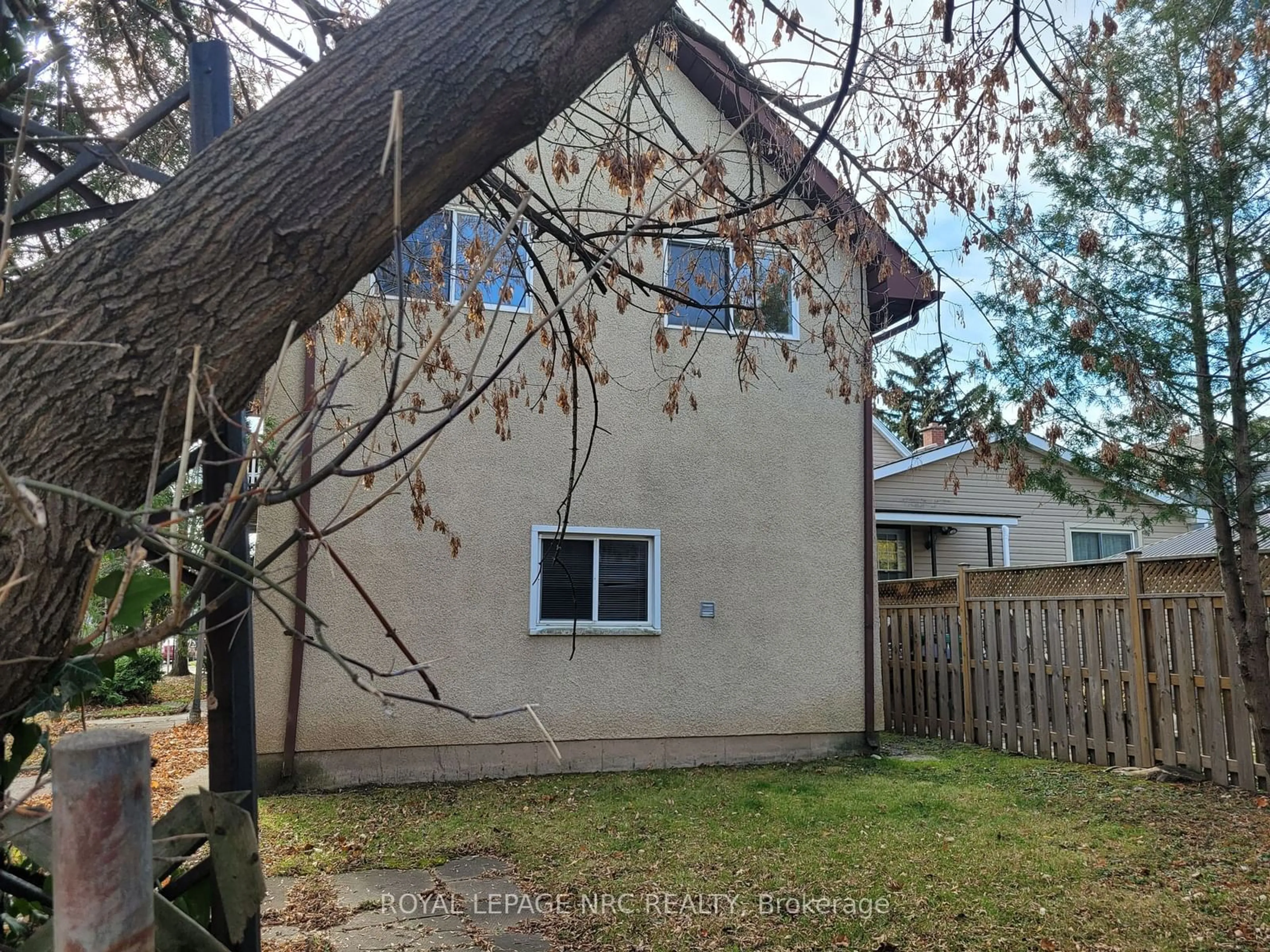 Frontside or backside of a home, the fenced backyard for 44 Albert St, Welland Ontario L3B 4L2