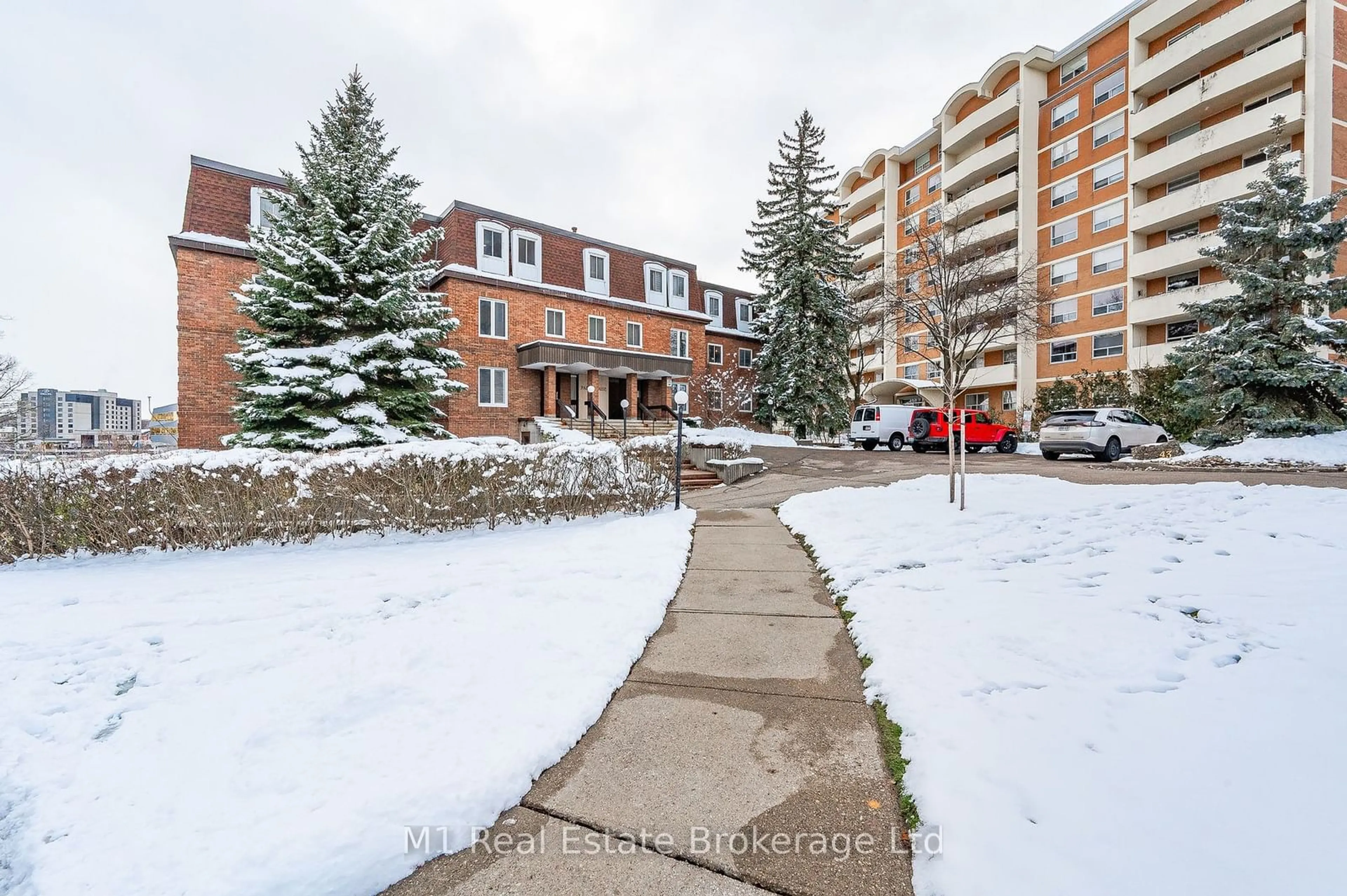 A pic from exterior of the house or condo, the street view for 43 Caroline St #302, Waterloo Ontario N2L 2Y5