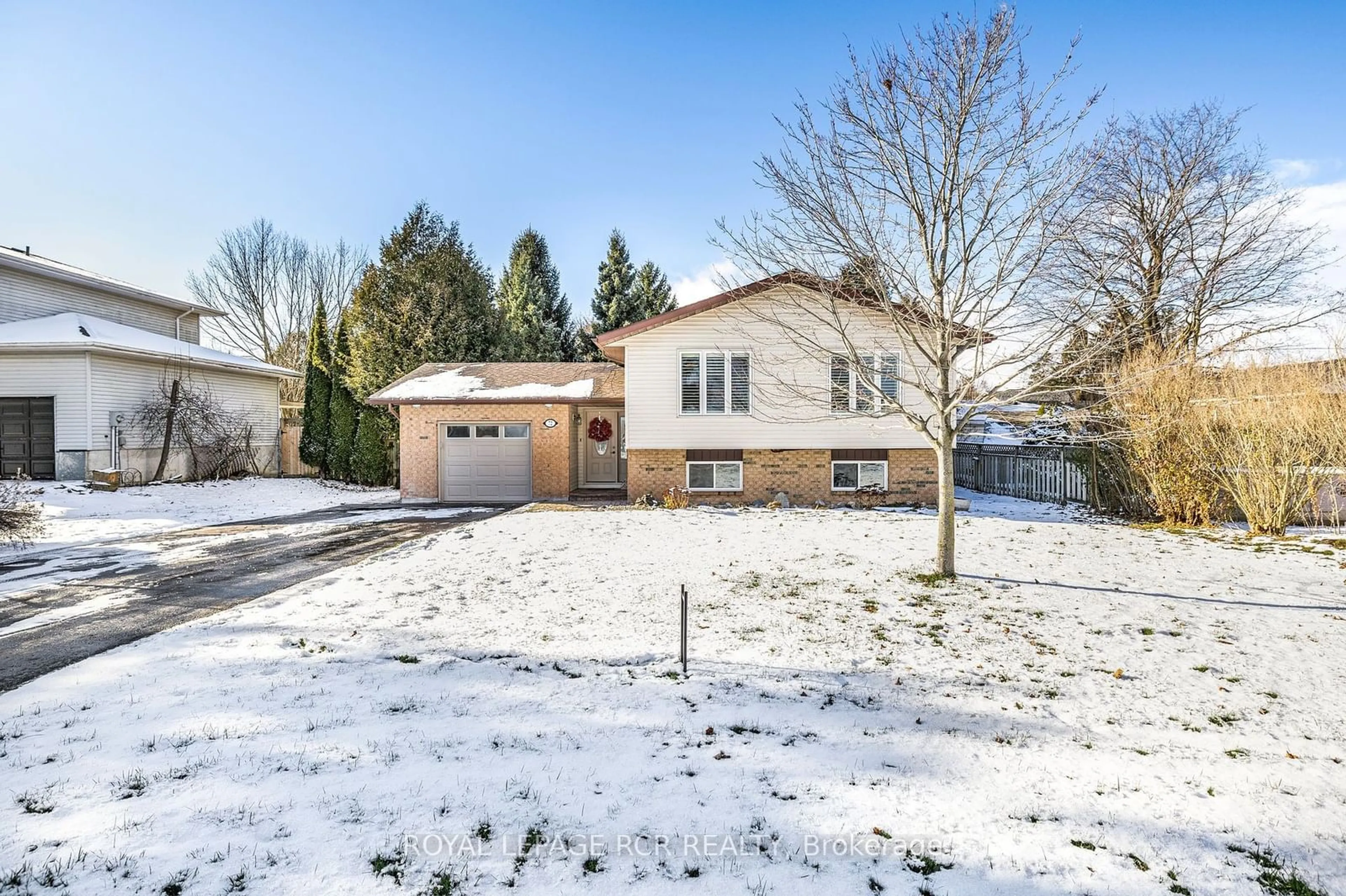 Frontside or backside of a home, the fenced backyard for 72 Cooper St, East Luther Grand Valley Ontario L9W 5N5